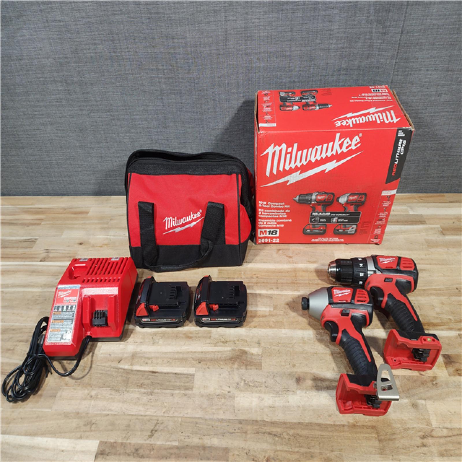 HOUSTON LOCATION - AS-IS Milwaukee M18 18V Lithium-Ion Cordless Drill Driver/Impact Driver Combo Kit