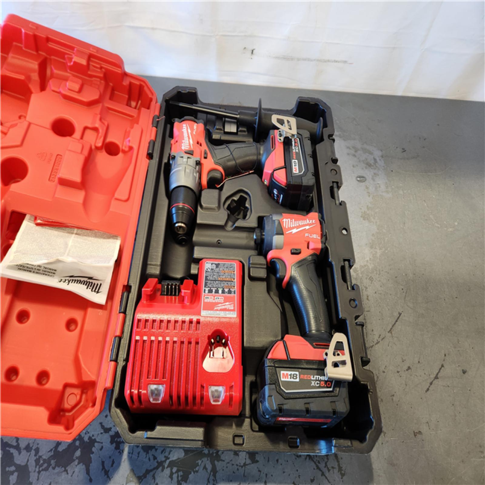 AS-IS- Milwaukee FUEL 18V Lithium-Ion Brushless Cordless Hammer Drill and Impact Driver Combo Kit
