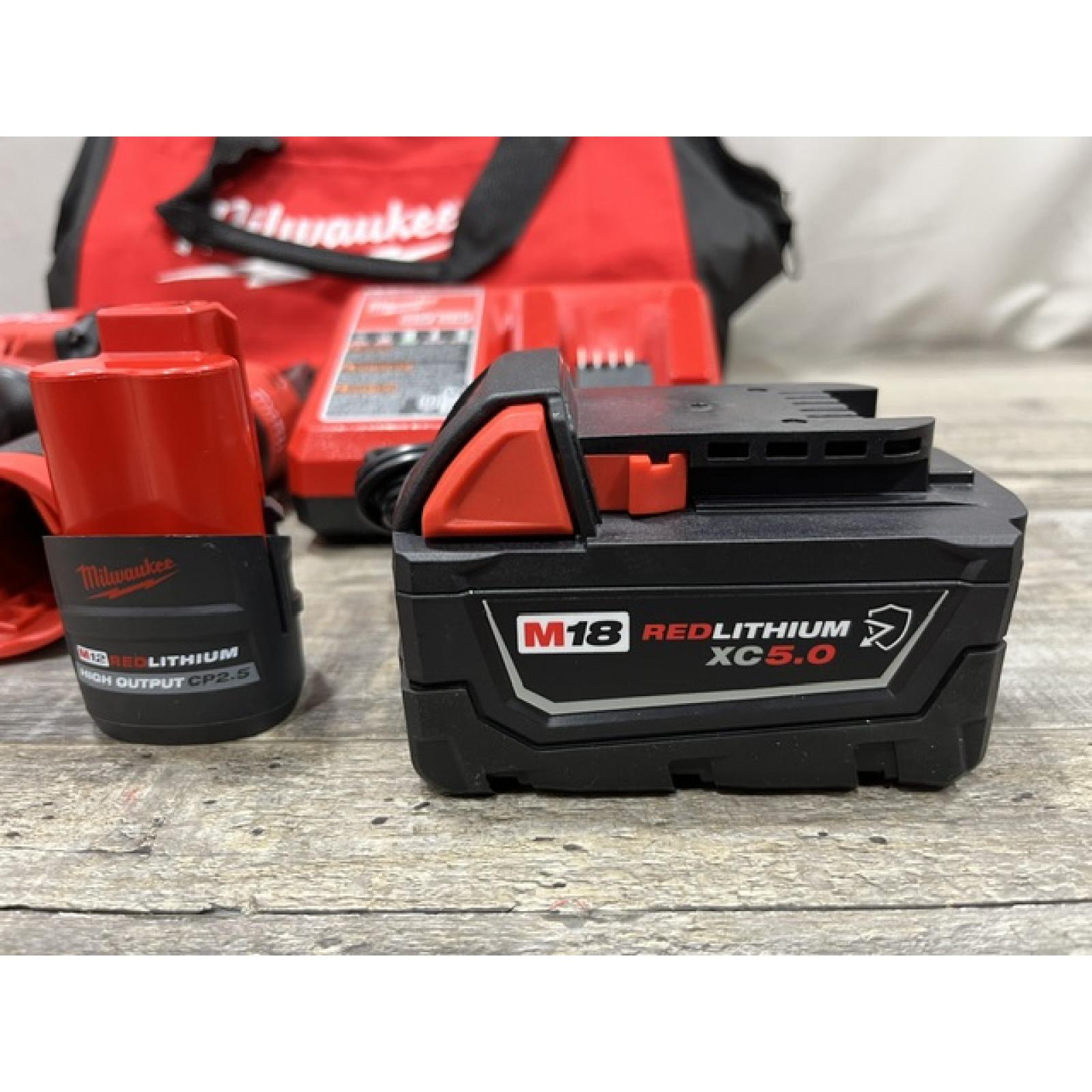 AS-IS Milwaukee FUEL 18V Cordless Mid Torque 1/2 in. Impact Wrench w/ 12 FUEL 3/8 in. Ratchet Combo Kit
