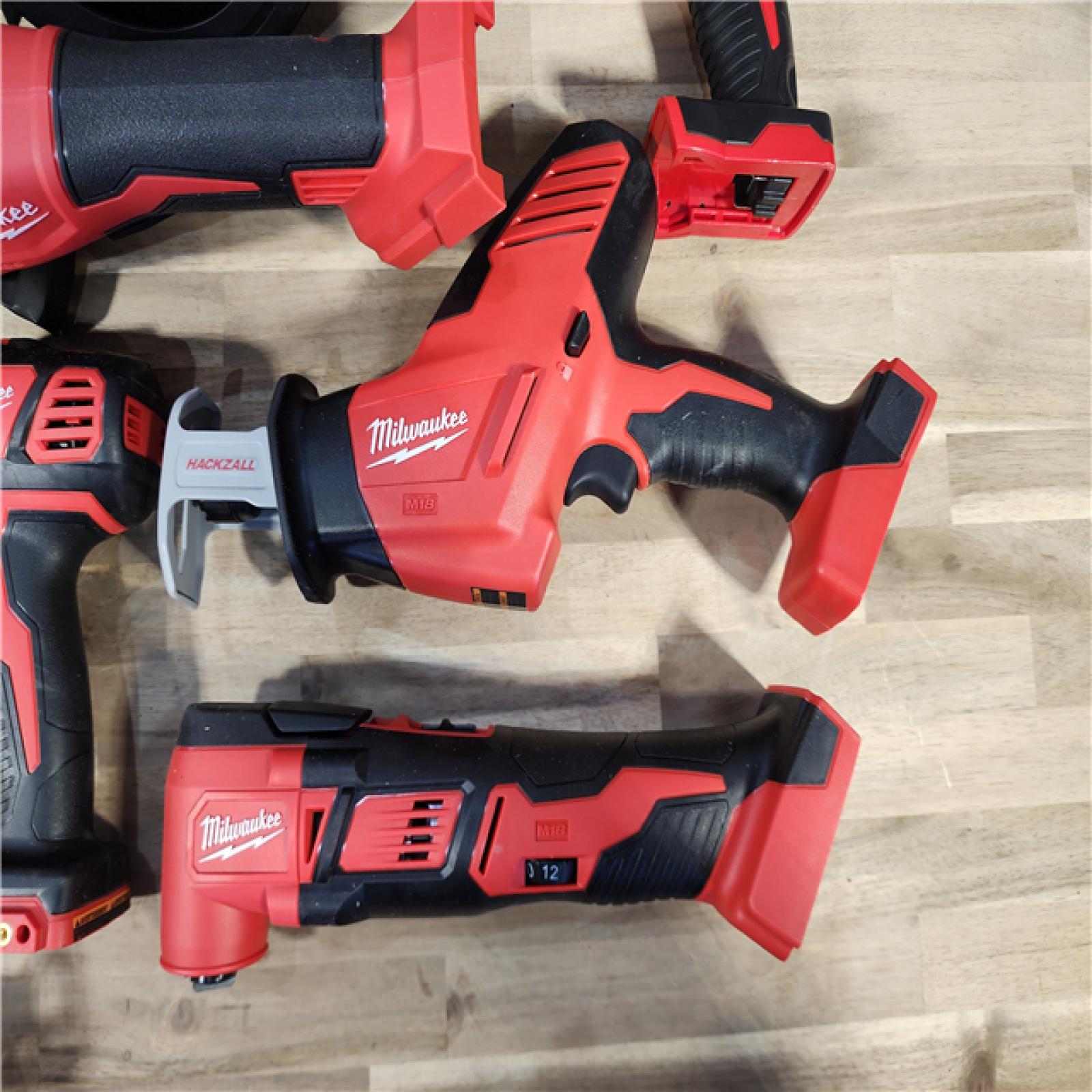 HOUSTON LOCATION - AS-IS Milwaukee M18 18-Volt Lithium-Ion Cordless Combo Kit 7-Tool with 2-Batteries, Charger and Tool Bag
