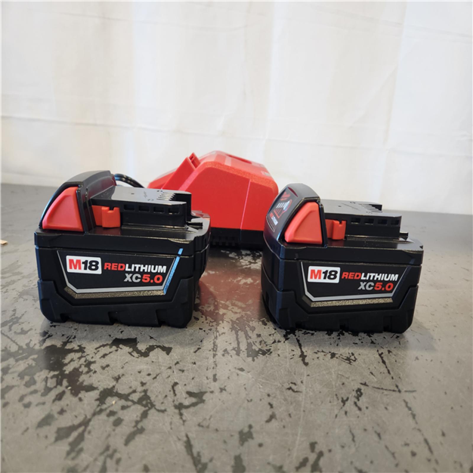 AS-IS- Milwaukee 18-Volt Lithium-Ion XC Starter Kit with Two 5.0Ah Batteries and Charger