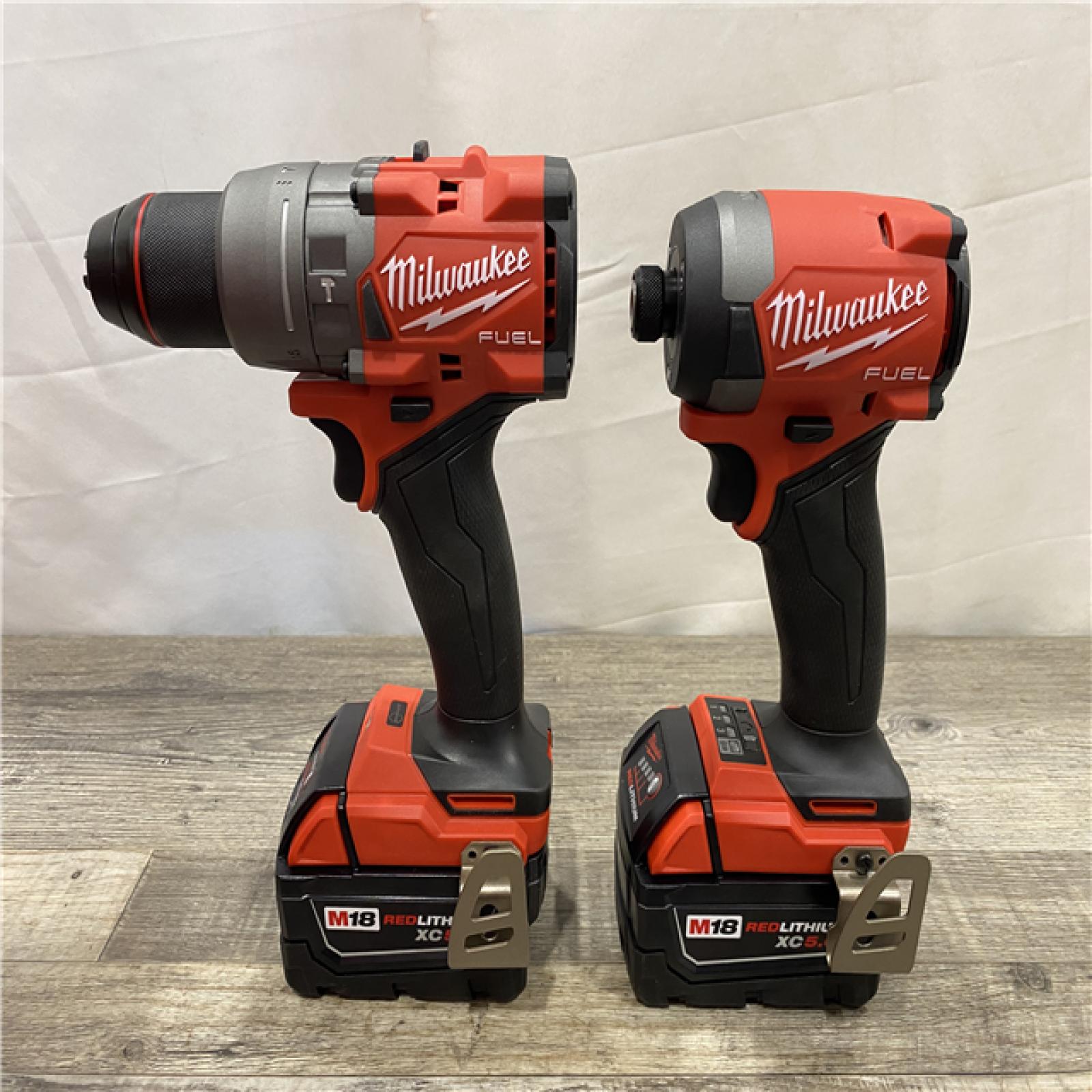 AS-IS Milwaukee FUEL 18V Lithium-Ion Brushless Cordless Hammer Drill and Impact Driver Combo Kit