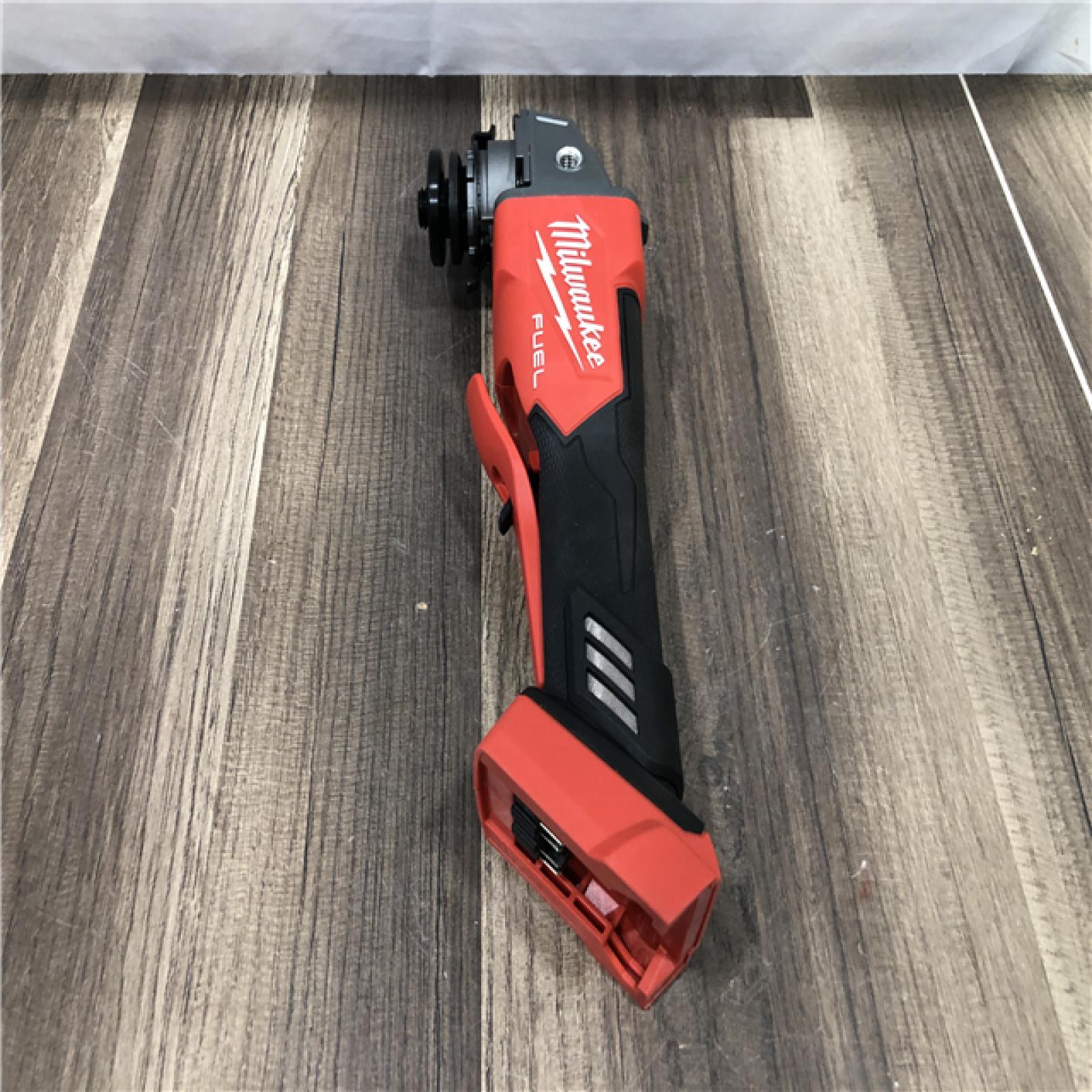 AS-IS Milwaukee FUEL 18V Lithium-Ion Brushless Cordless 4-1/2 in./5 in. Grinder w/Paddle Switch (Tool-Only)