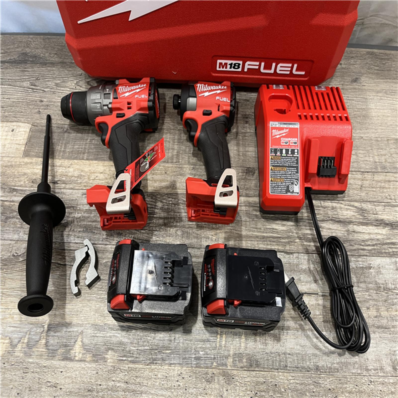 AS-IS Milwaukee FUEL 18V Lithium-Ion Brushless Cordless Hammer Drill and Impact Driver Combo Kit