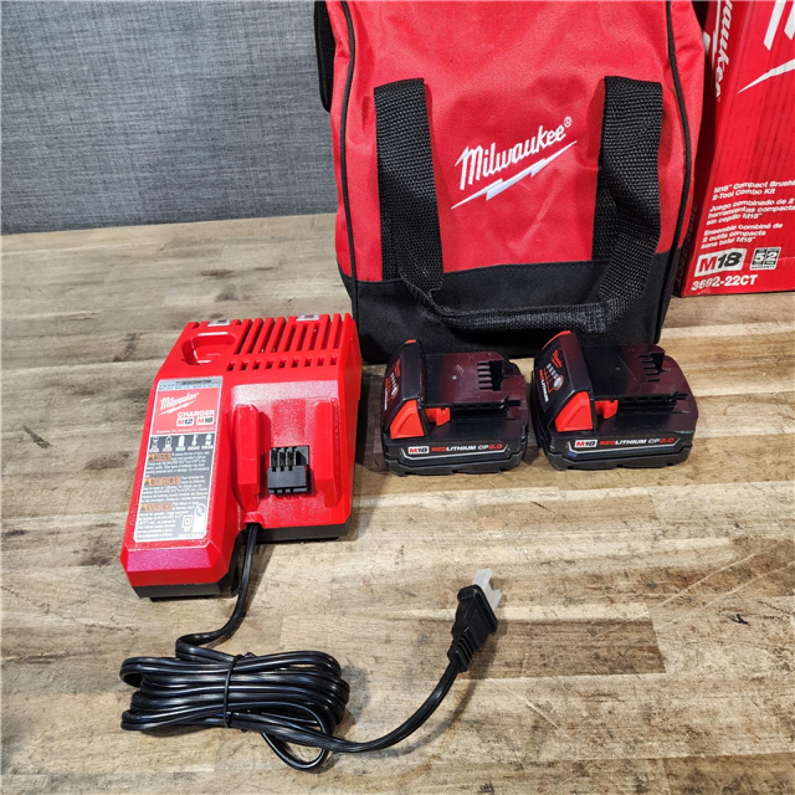 HOUSTON LOCATION - AS-IS Milwaukee M18 18V Lithium-Ion Brushless Cordless Compact Drill/Impact Combo Kit (2-Tool) W/(2) 2.0 Ah Batteries  Charger & Bag
