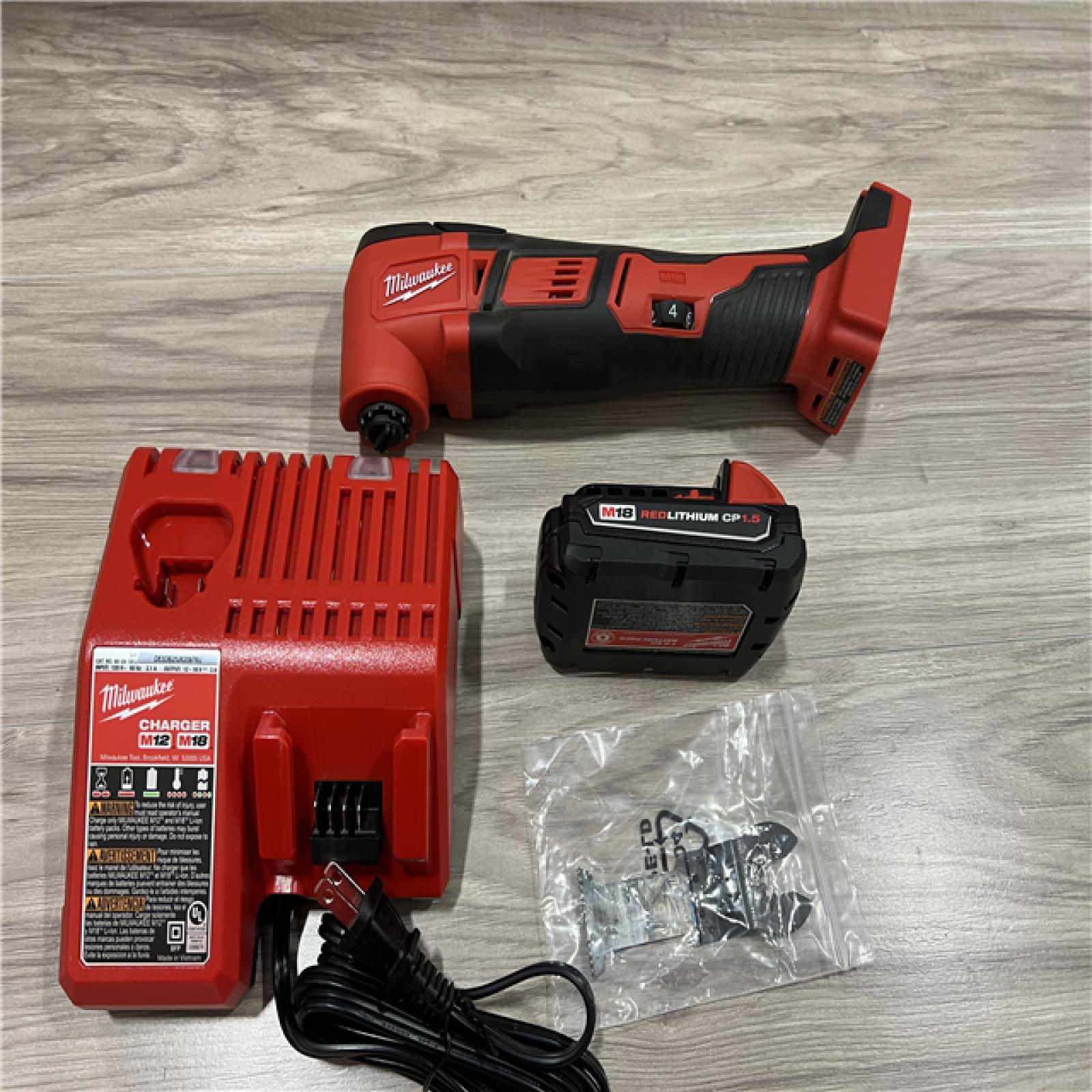 AS-IS Milwaukee 2626-21 M18 18V Cordless Oscillating Multi-Tool  Variable Speed  REDLITHIUM Battery Compatible  Fast Cutting  Sanding & Scraping Kit
