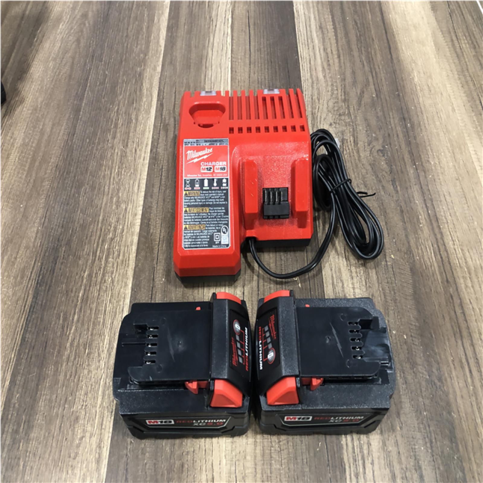 AS-IS Milwaukee 18-Volt Lithium-Ion XC Starter Kit with (2) 5.0Ah Batteries and Charger