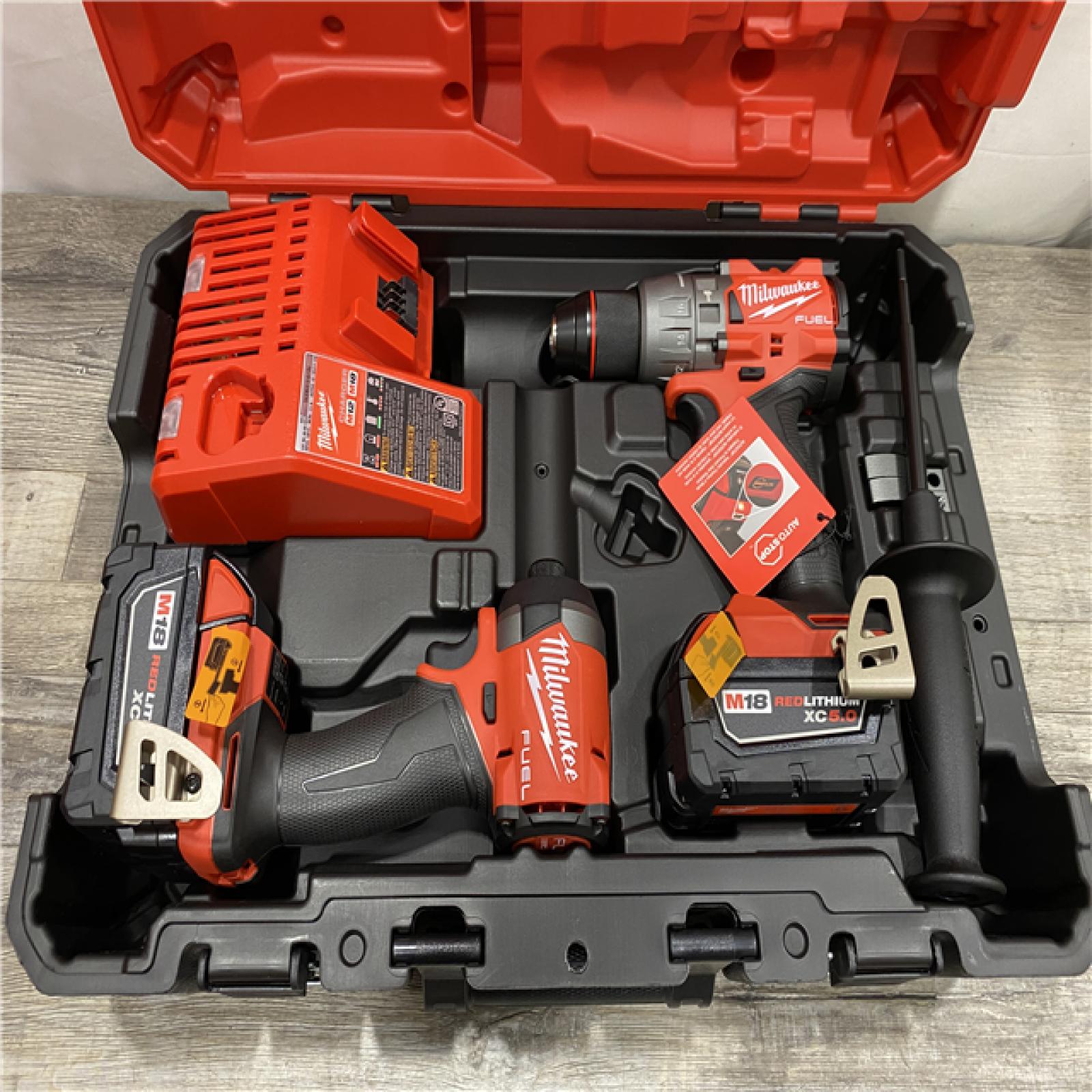 AS-IS Milwaukee FUEL 18V Lithium-Ion Brushless Cordless Hammer Drill and Impact Driver Combo Kit