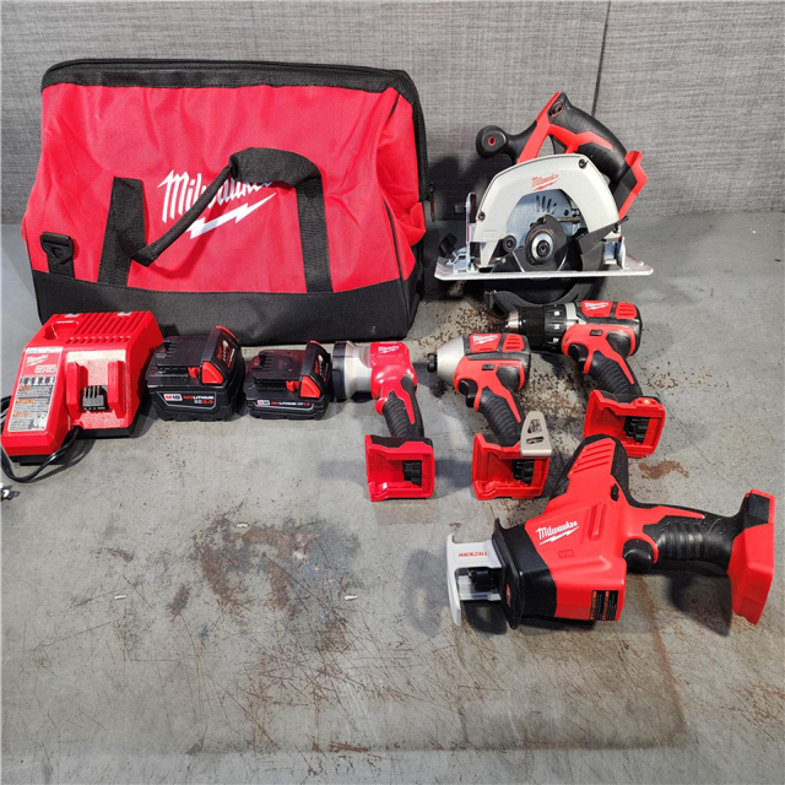 HOUSTON LOCATION - AS-IS Milwaukee M18 18-Volt Lithium-Ion Cordless Combo Tool Kit (5-Tool) with (1) 3.0Ah and (1) 1.5Ah Battery, (1) Charger, (1) Tool Bag