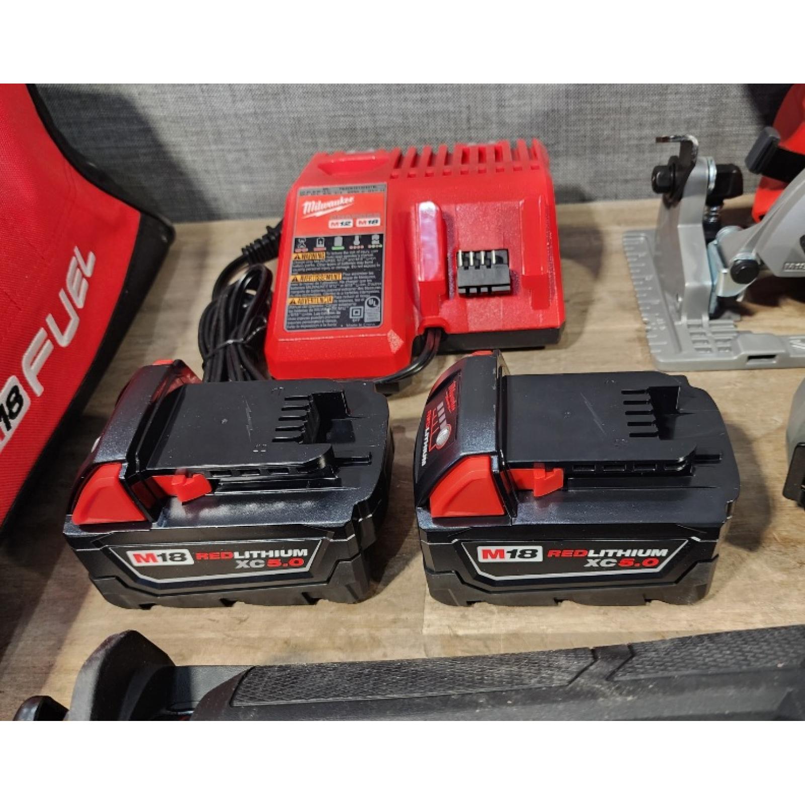 HOUSTON LOCATION - AS-IS Milwaukee M18 FUEL 18V Lithium-Ion Brushless Cordless Combo Kit with Two 5.0 Ah Batteries  1 Charger  2 Tool Bags (7-Tool)