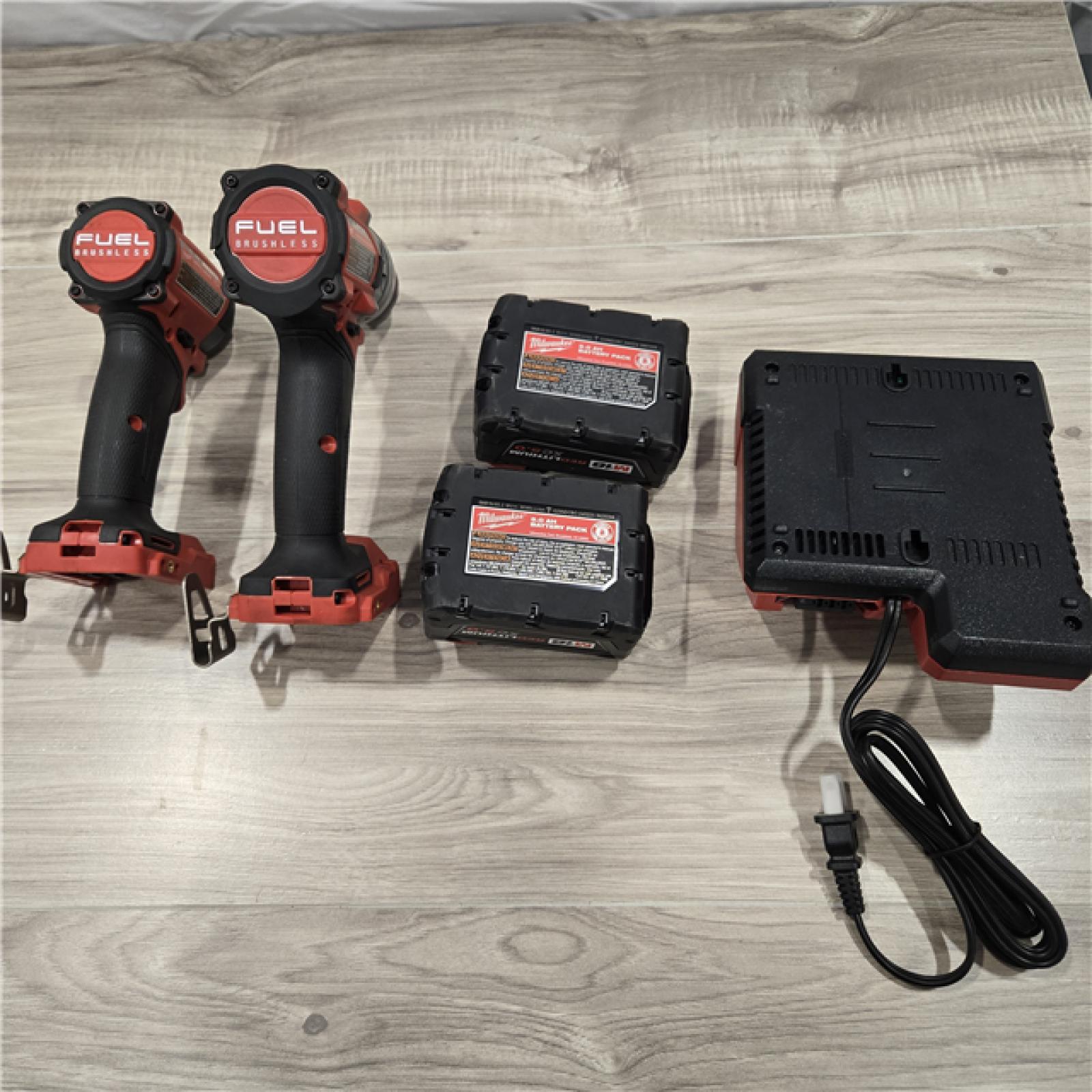 AS-IS MILWAUKEE FUEL 18V Lithium-Ion Brushless Cordless Hammer Drill and Impact Driver Combo Kit (2-Tool) with 2 Batteries