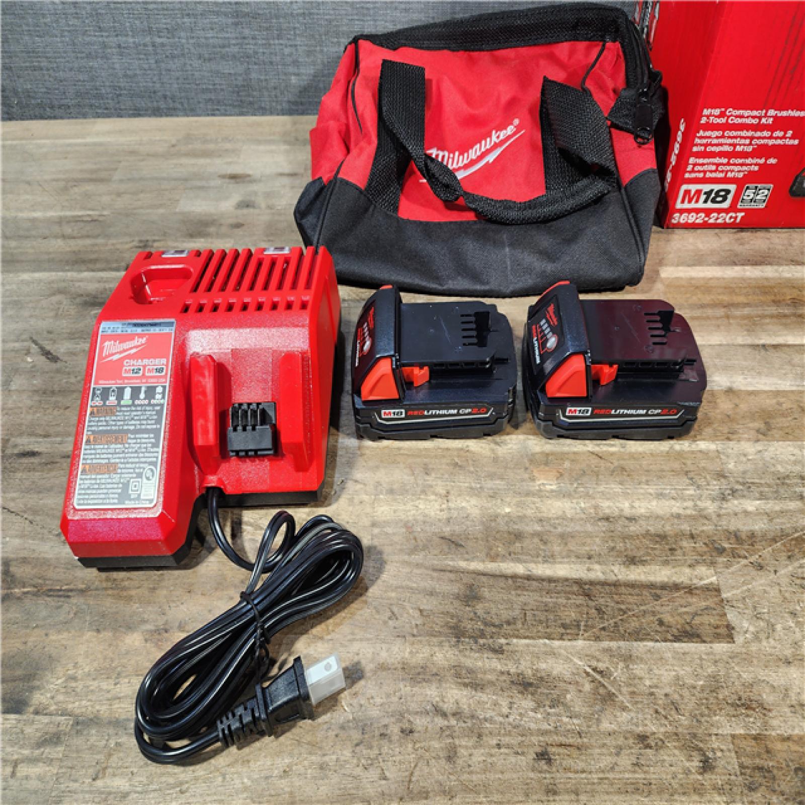 HOUSTON LOCATION - AS-IS Milwaukee M18 18V Lithium-Ion Brushless Cordless Compact Drill/Impact Combo Kit (2-Tool) W/(2) 2.0 Ah Batteries  Charger & Bag