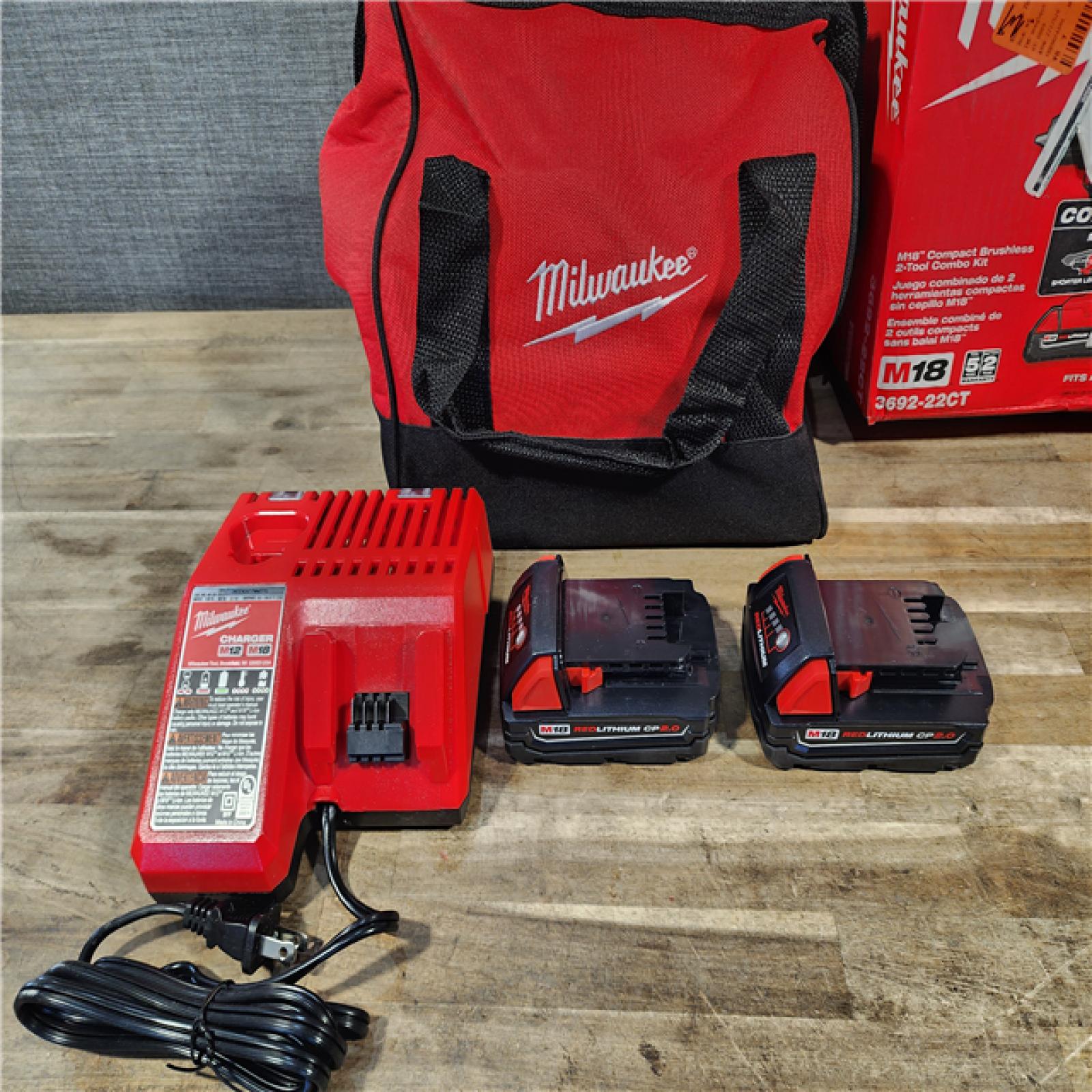 HOUSTON LOCATION - AS-IS Milwaukee M18 18V Lithium-Ion Brushless Cordless Compact Drill/Impact Combo Kit (2-Tool) W/(2) 2.0 Ah Batteries  Charger & Bag