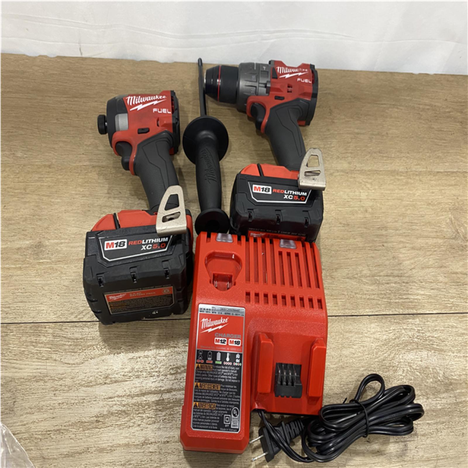 AS-IS Milwaukee FUEL 18V Lithium-Ion Brushless Cordless Hammer Drill and Impact Driver Combo Kit