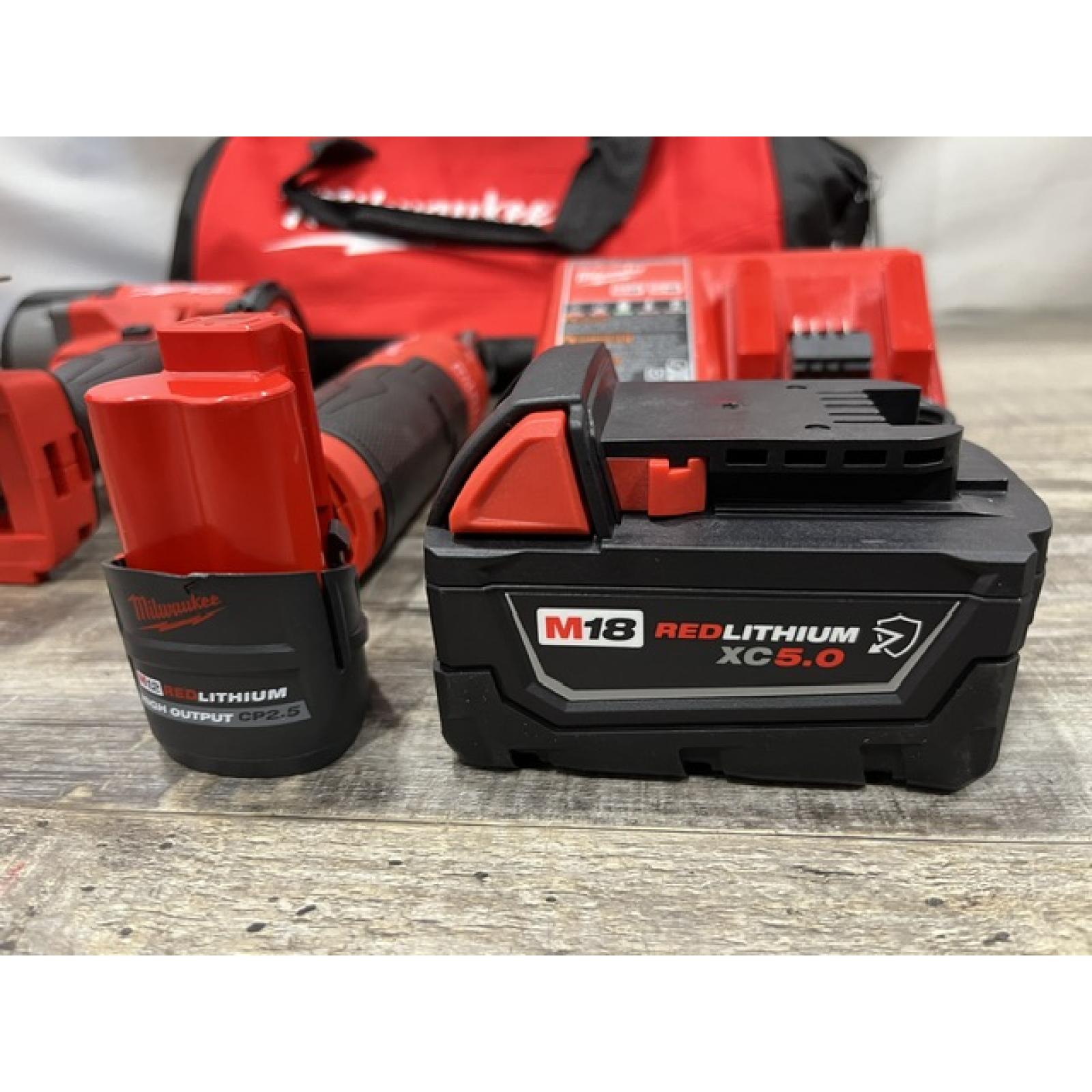 AS-IS Milwaukee FUEL 18V Cordless Mid Torque 1/2 in. Impact Wrench w/ 12 FUEL 3/8 in. Ratchet Combo Kit
