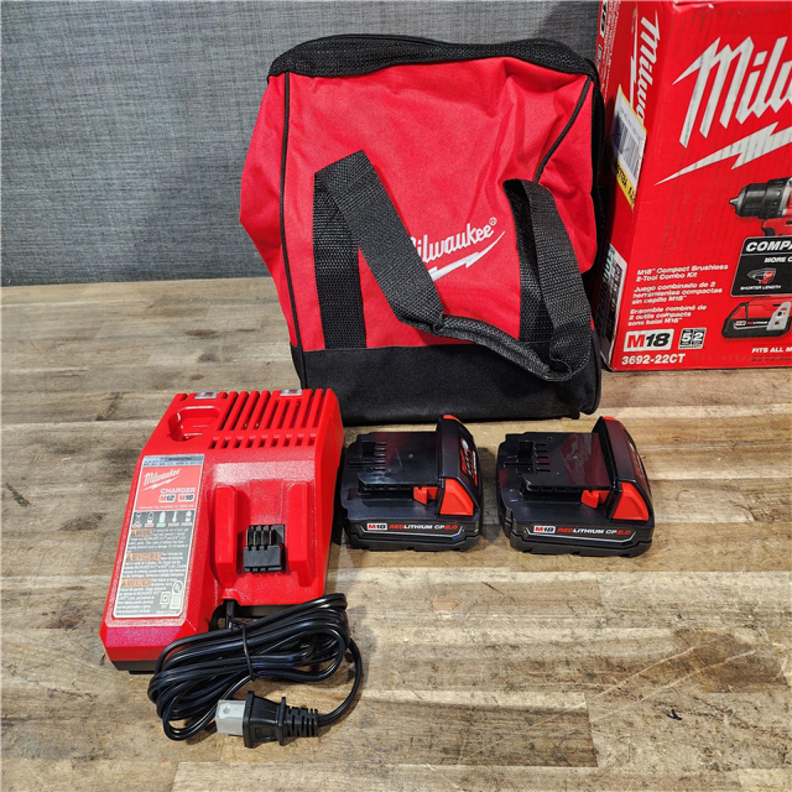 HOUSTON LOCATION - AS-IS Milwaukee M18 18V Lithium-Ion Brushless Cordless Compact Drill/Impact Combo Kit (2-Tool) W/(2) 2.0 Ah Batteries  Charger & Bag
