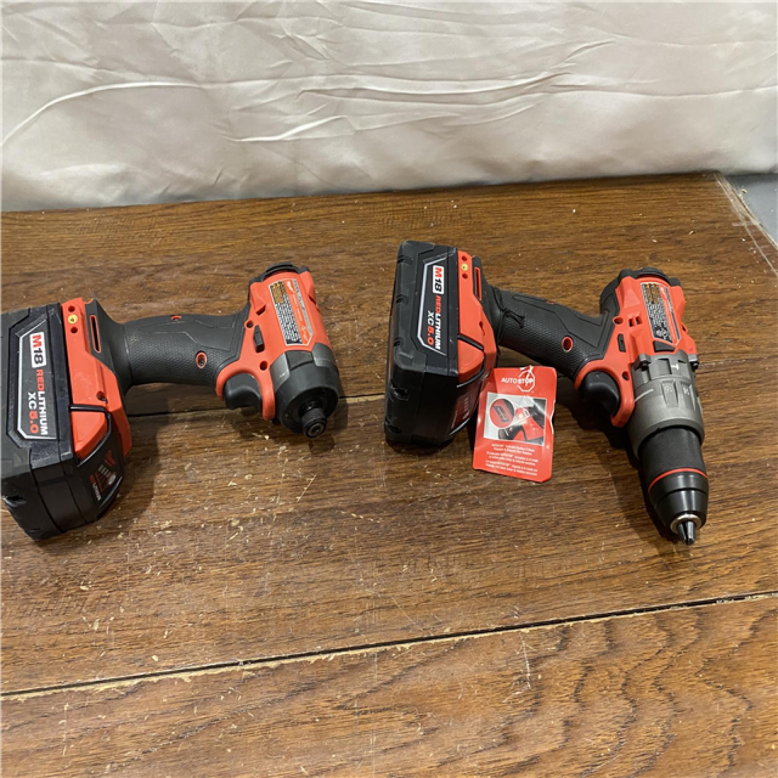 AS-IS MILWAUKEE M18 FUEL 18V Lithium-Ion Brushless Cordless Hammer Drill and Impact Driver Combo Kit (2-Tool) with 2 Batteries