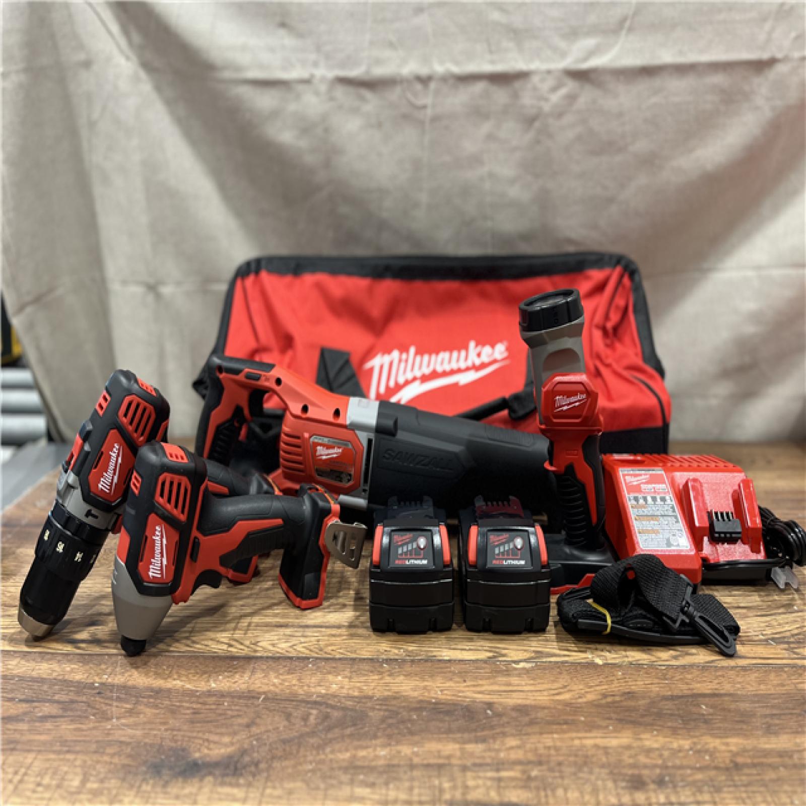 AS-IS MILWAUKEE M18 18V Lithium-Ion Cordless Combo Tool Kit with Two 3.0Ah Batteries, 1-Charger, 1-Tool Bag (4-Tool)