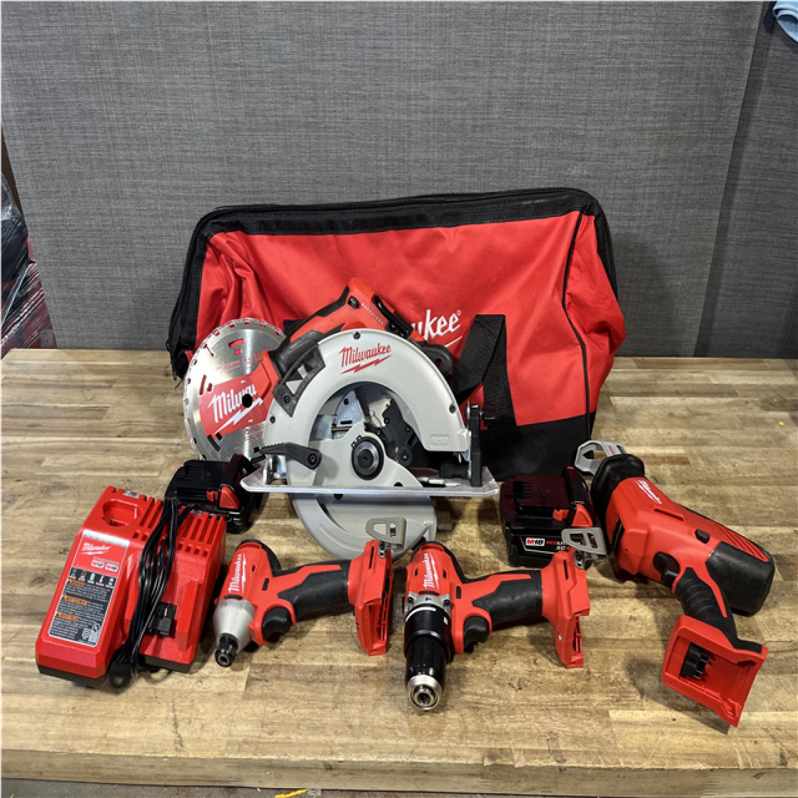 Houston Location AS-IS Milwaukee Hammer Drill Driver and Impact Driver Hackzall and Circular Saw and Batteries QTY/2 with Charger