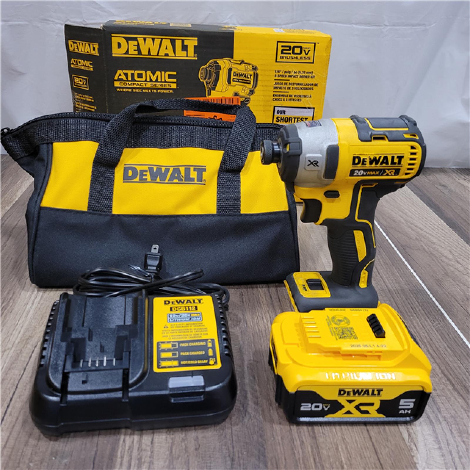 AS-IS DEWALT ATOMIC 20V MAX Lithium-Ion Cordless 1/4 in. Brushless Impact Driver Kit, 5 Ah Battery, Charger, and Bag