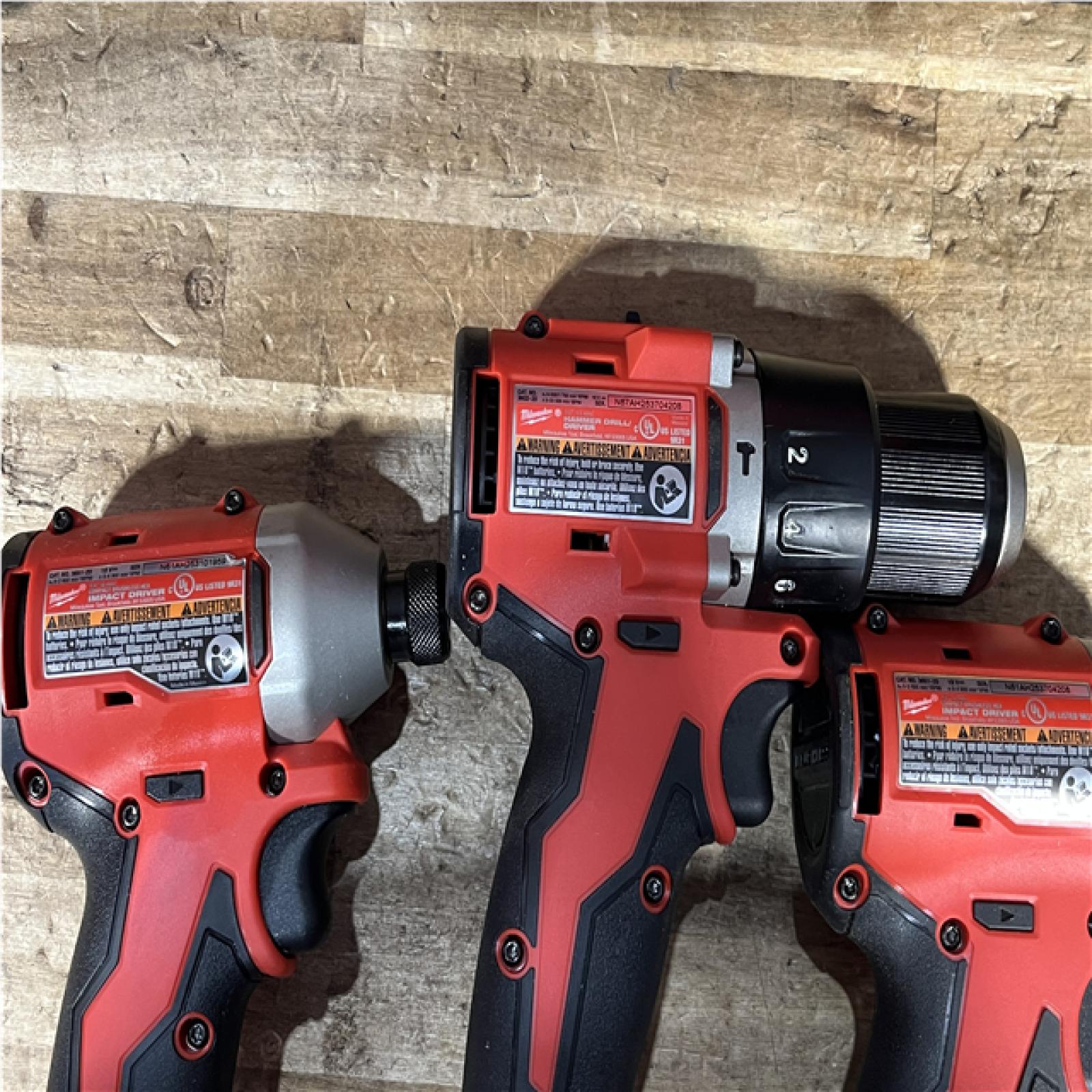 Houston Location AS-IS Milwaukee Hammer Drill Driver and Impact Drivers QTY/2 and Batteries QTY/2 with Charger