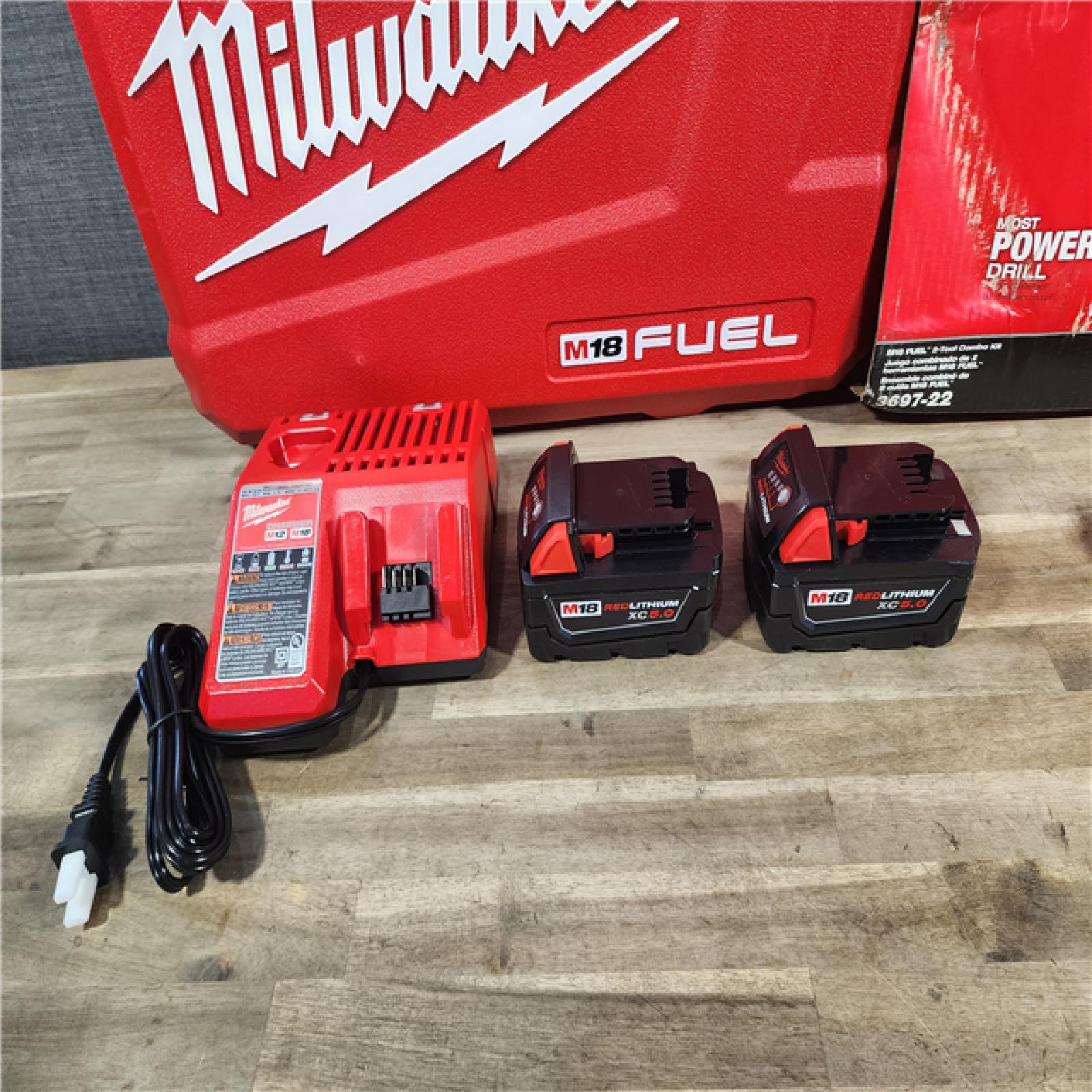 HOUSTON LOCATION - AS-IS (APPEARS LIKE NEW) MILWAUKEE FUEL 18V Lithium-Ion Brushless Cordless Hammer Drill and Impact Driver Combo Kit (2-Tool) with 2 Batteries
