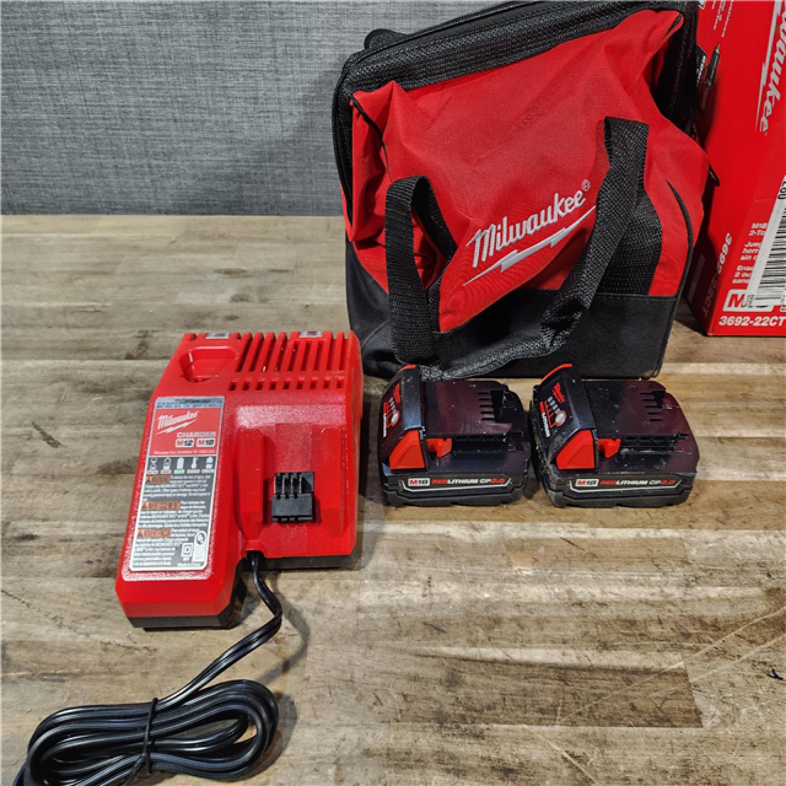 HOUSTON LOCATION - AS-IS Milwaukee M18 18V Lithium-Ion Brushless Cordless Compact Drill/Impact Combo Kit (2-Tool) W/(2) 2.0 Ah Batteries  Charger & Bag