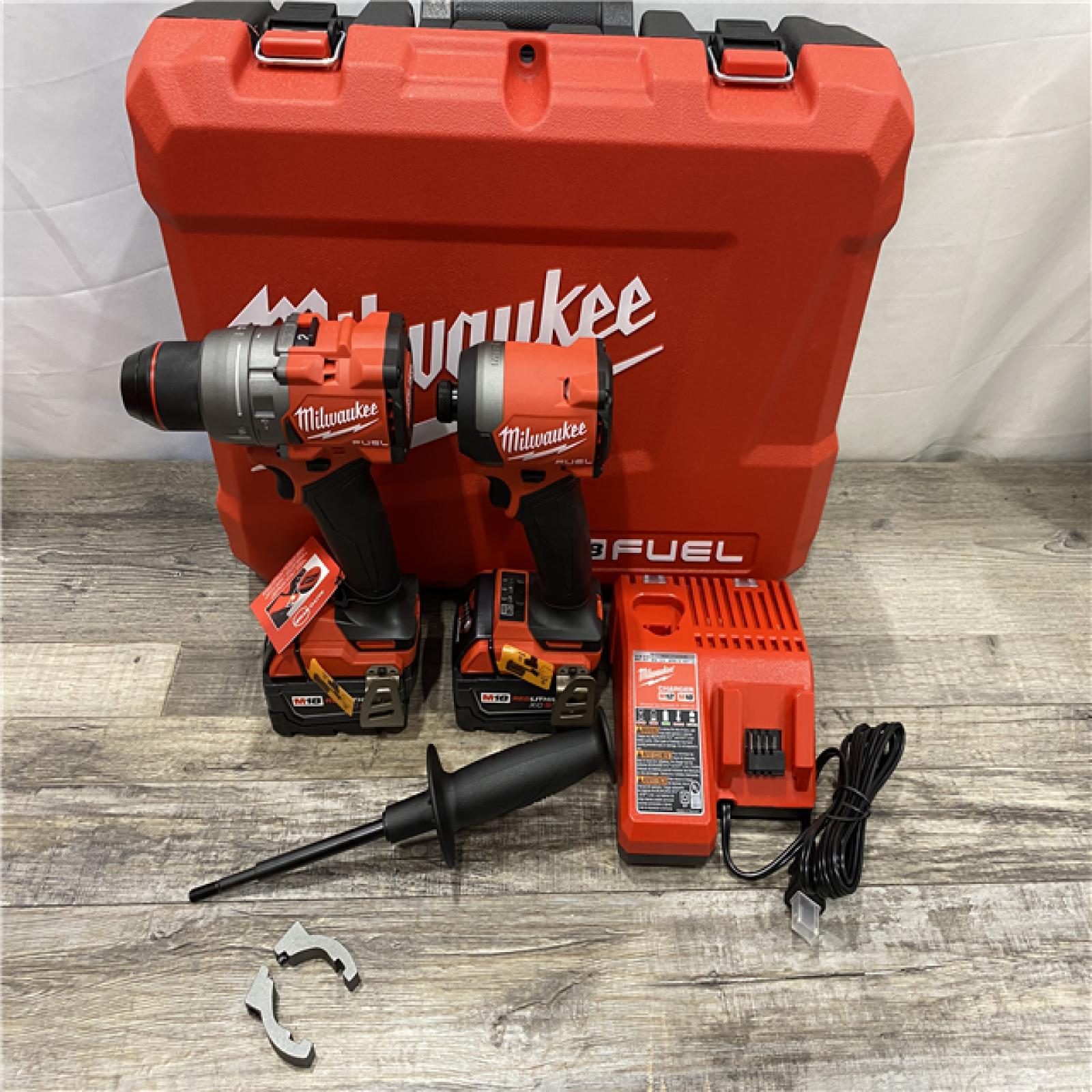 AS-IS Milwaukee FUEL 18V Lithium-Ion Brushless Cordless Hammer Drill and Impact Driver Combo Kit