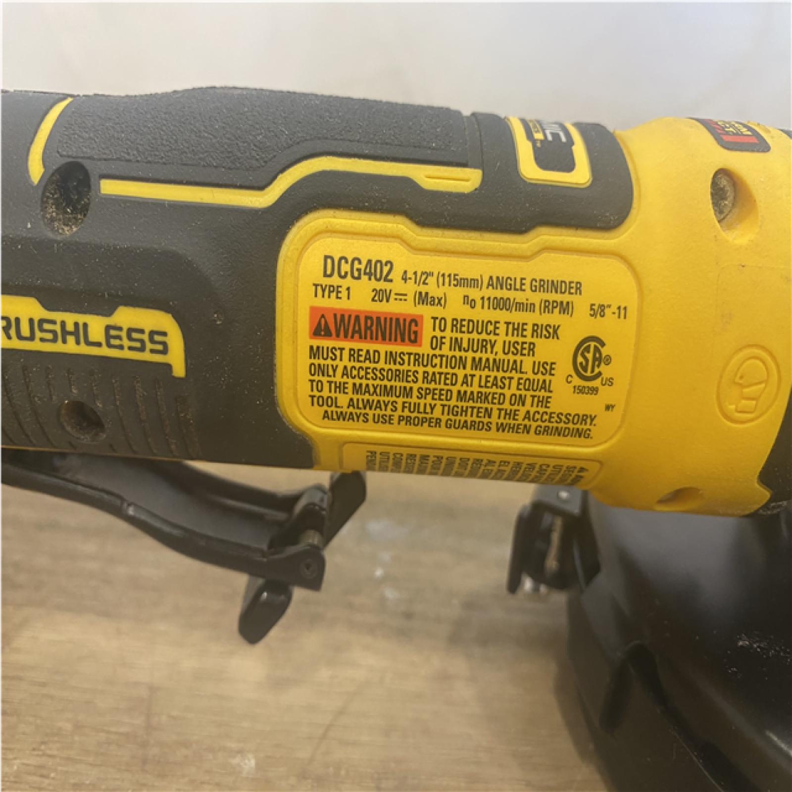 AS-IS DEWALT ATOMIC 20V MAX Cordless 4-1/2 in. Angle Grinder with Paddle Switch (Tool Only)