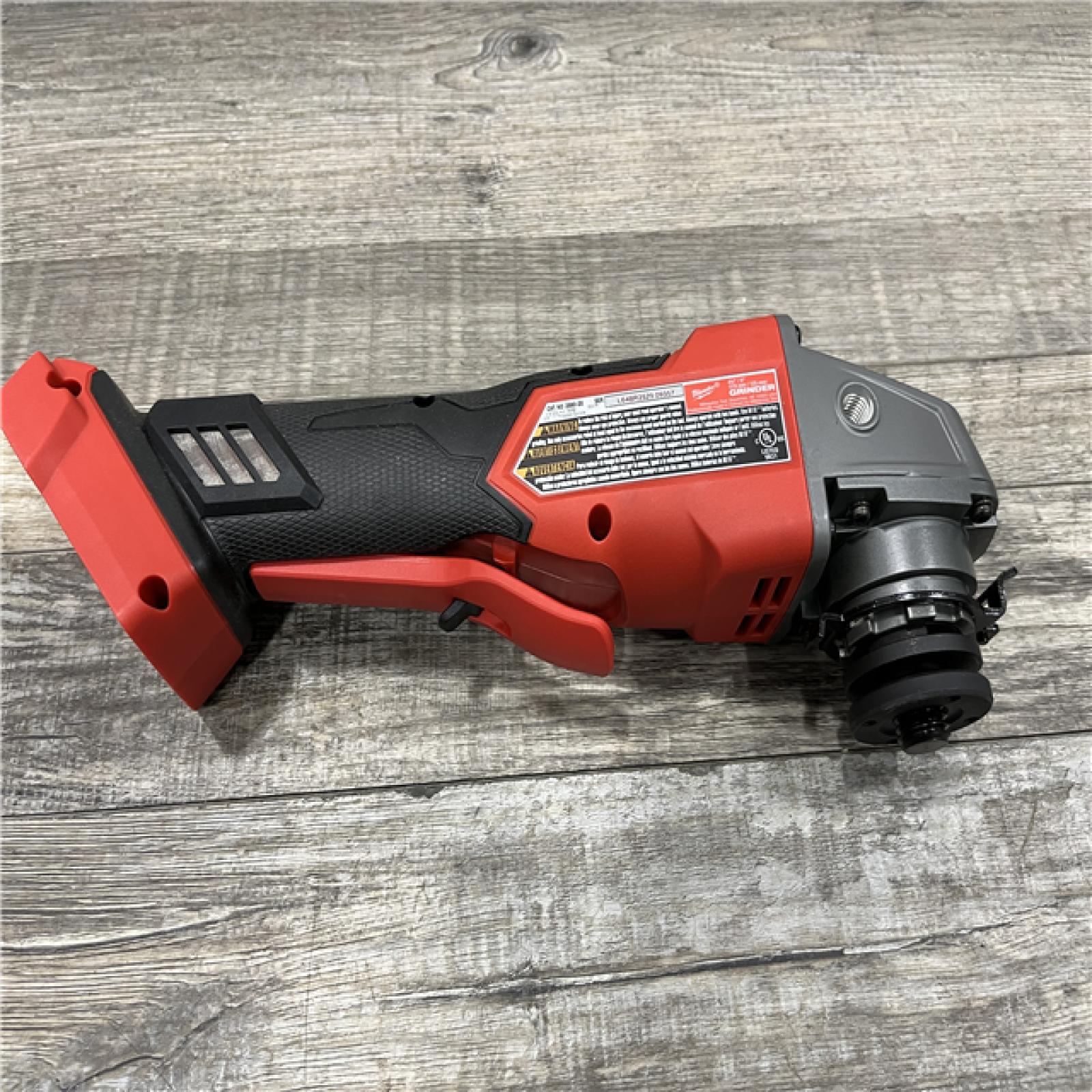 AS-IS Milwaukee FUEL 18V Lithium-Ion Brushless Cordless 4-1/2 in./5 in. Grinder w/Paddle Switch (Tool-Only)