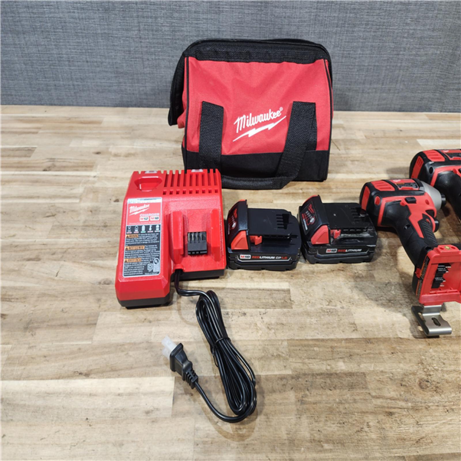 HOUSTON LOCATION - AS - IS Milwaukee 18V Lithium-Ion Cordless Drill Driver/Impact Driver Combo Kit