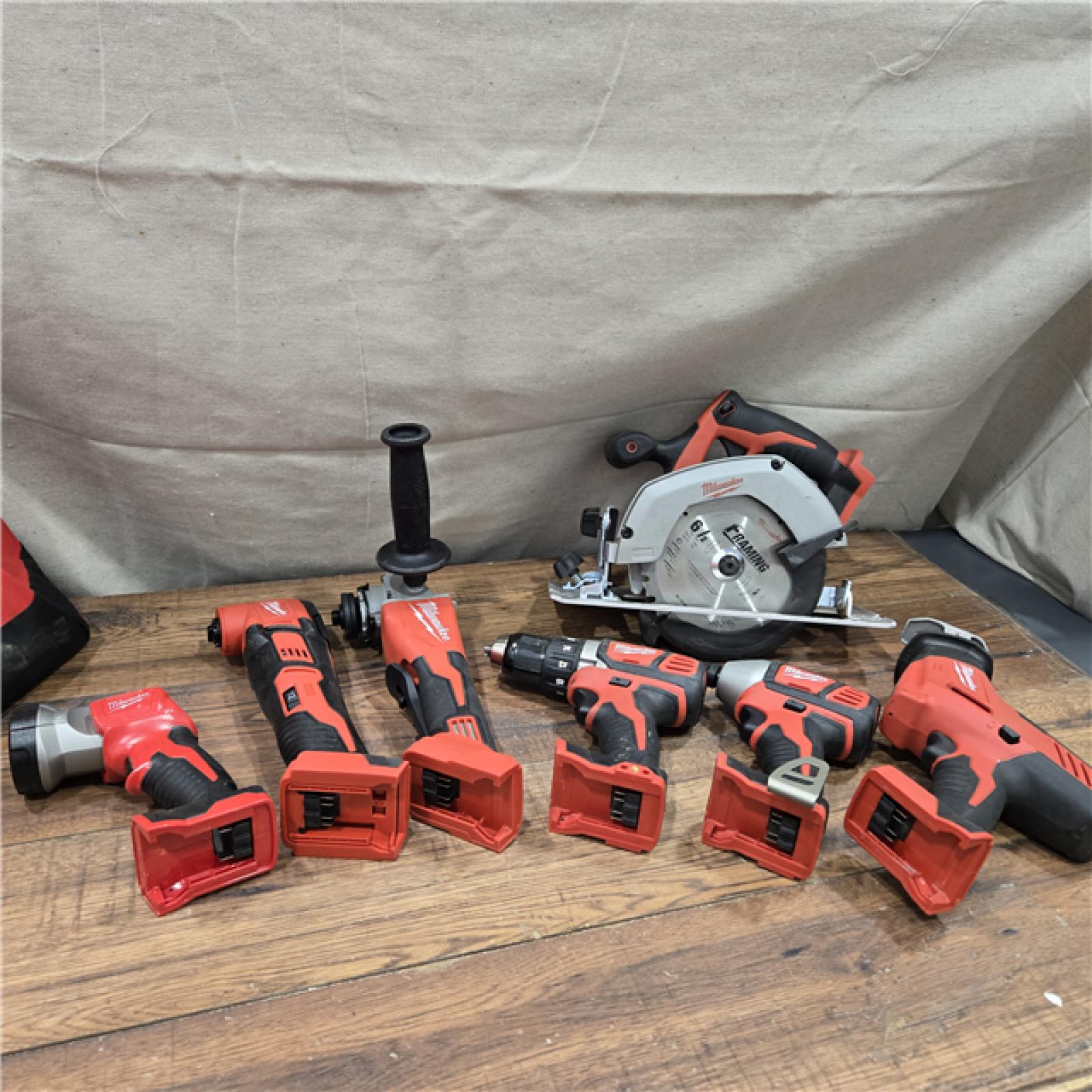 AS-IS Milwaukee M18 18-Volt Lithium-Ion Cordless Combo Kit 7-Tool with 2-Batteries, Charger and Tool Bag