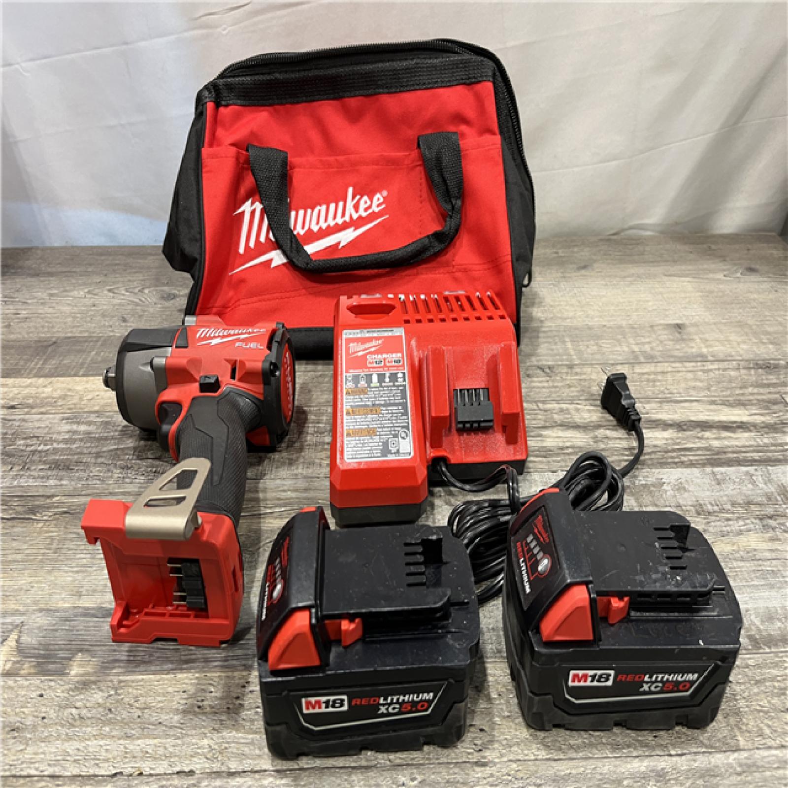 AS-IS Milwaukee FUEL 18V Lithium-Ion Brushless Cordless 1/2 in. Mid-Torque Impact Wrench with Friction Ring Kit