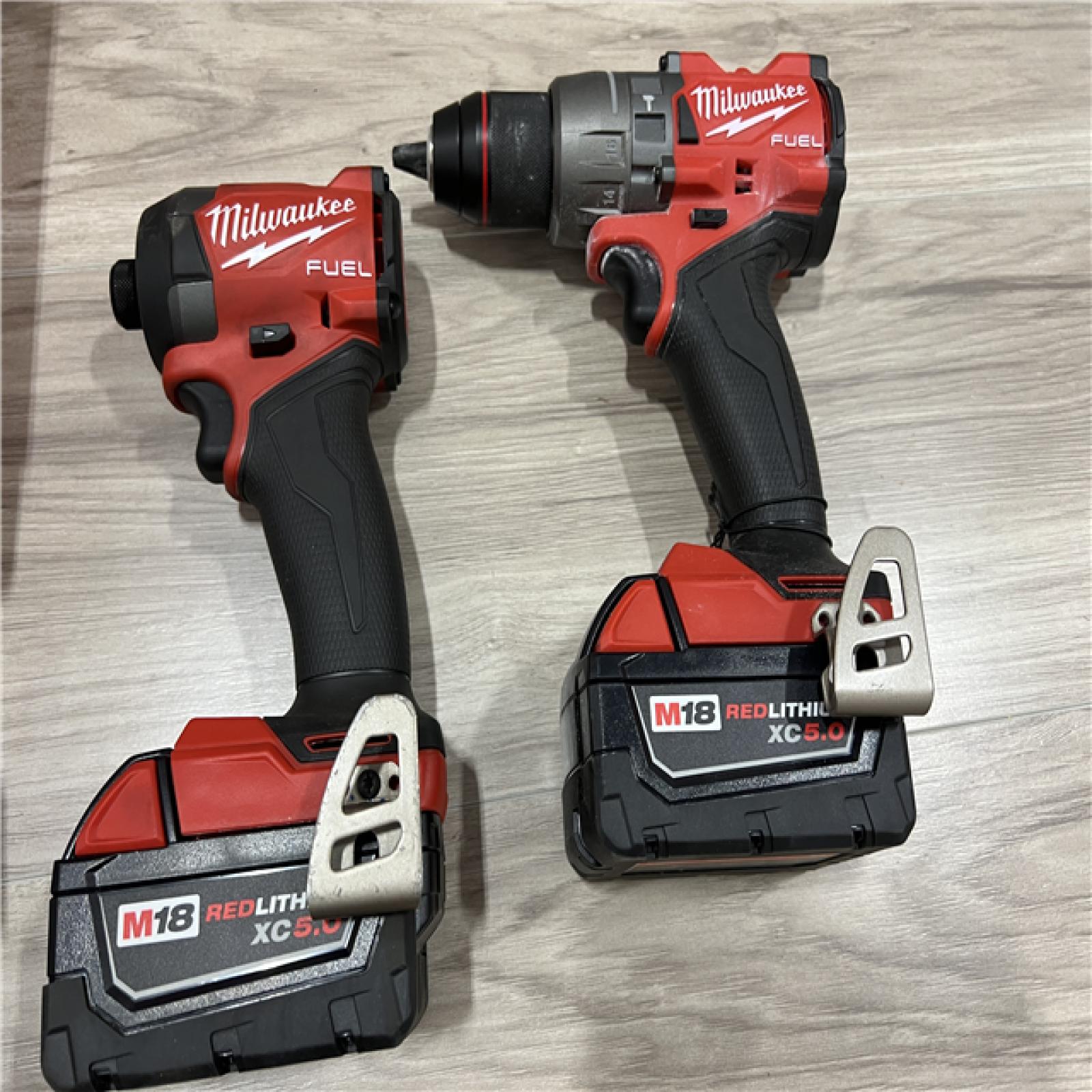 AS-IS Milwaukee FUEL 18V Lithium-Ion Brushless Cordless Hammer Drill and Impact Driver Combo Kit