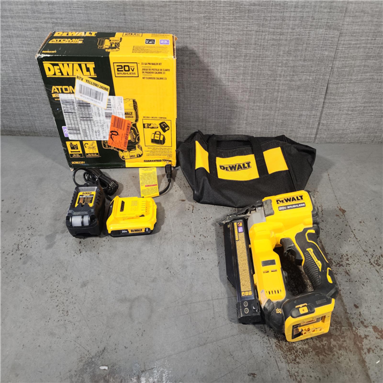 HOUSTON LOCATION - AS-IS DEWALT ATOMIC 20V MAX Lithium Ion Cordless 23 Gauge Pin Nailer Kit with 2.0Ah Battery and Charger