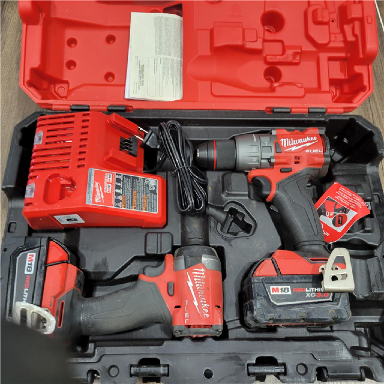 AS-IS MILWAUKEE M18 FUEL 18V Lithium-Ion Brushless Cordless Hammer Drill and Impact Driver Combo Kit (2-Tool) with 2 Batteries