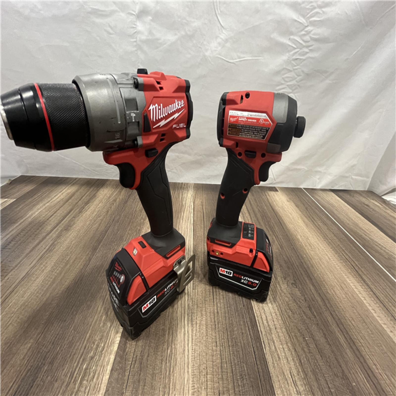 AS-IS MILWAUKEE FUEL 18V Lithium-Ion Brushless Cordless Hammer Drill and Impact Driver Combo Kit (2-Tool) with 2 Batteries