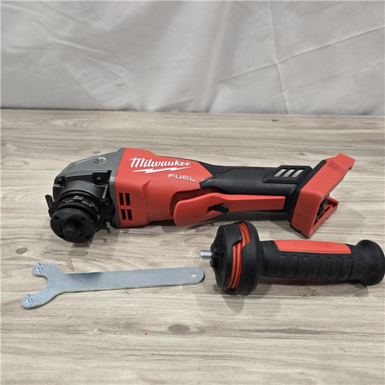 AS-IS Milwaukee 2880-20 FUEL 18V Cordless 4-1/2 in./5 in. Grinder (Tool-Only)
