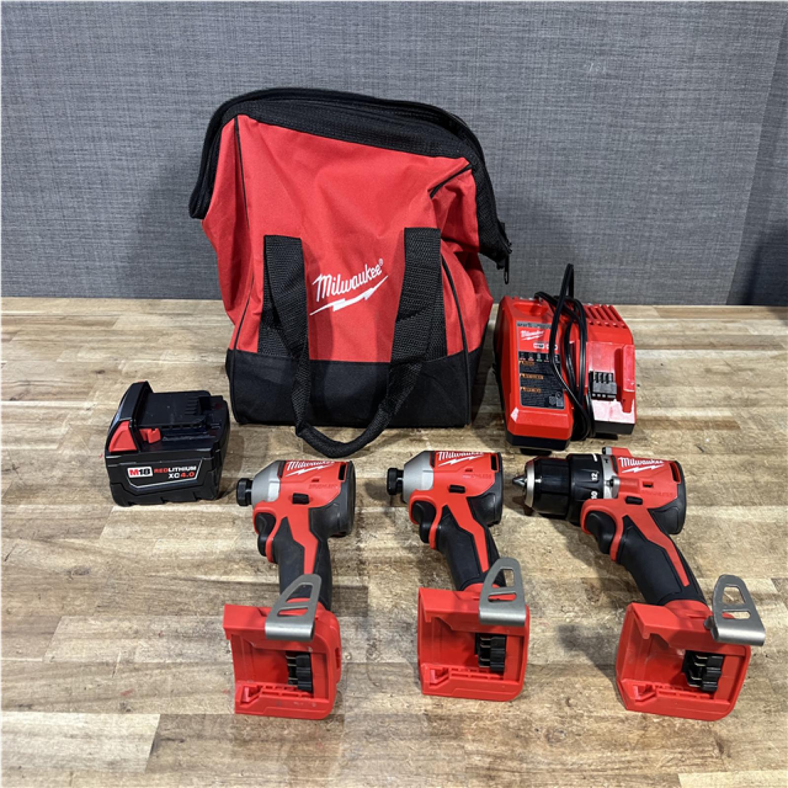 Houston Location AS-IS Milwaukee Hammer Drill Driver and Impact Drivers QTY/2 and Battery with Charger