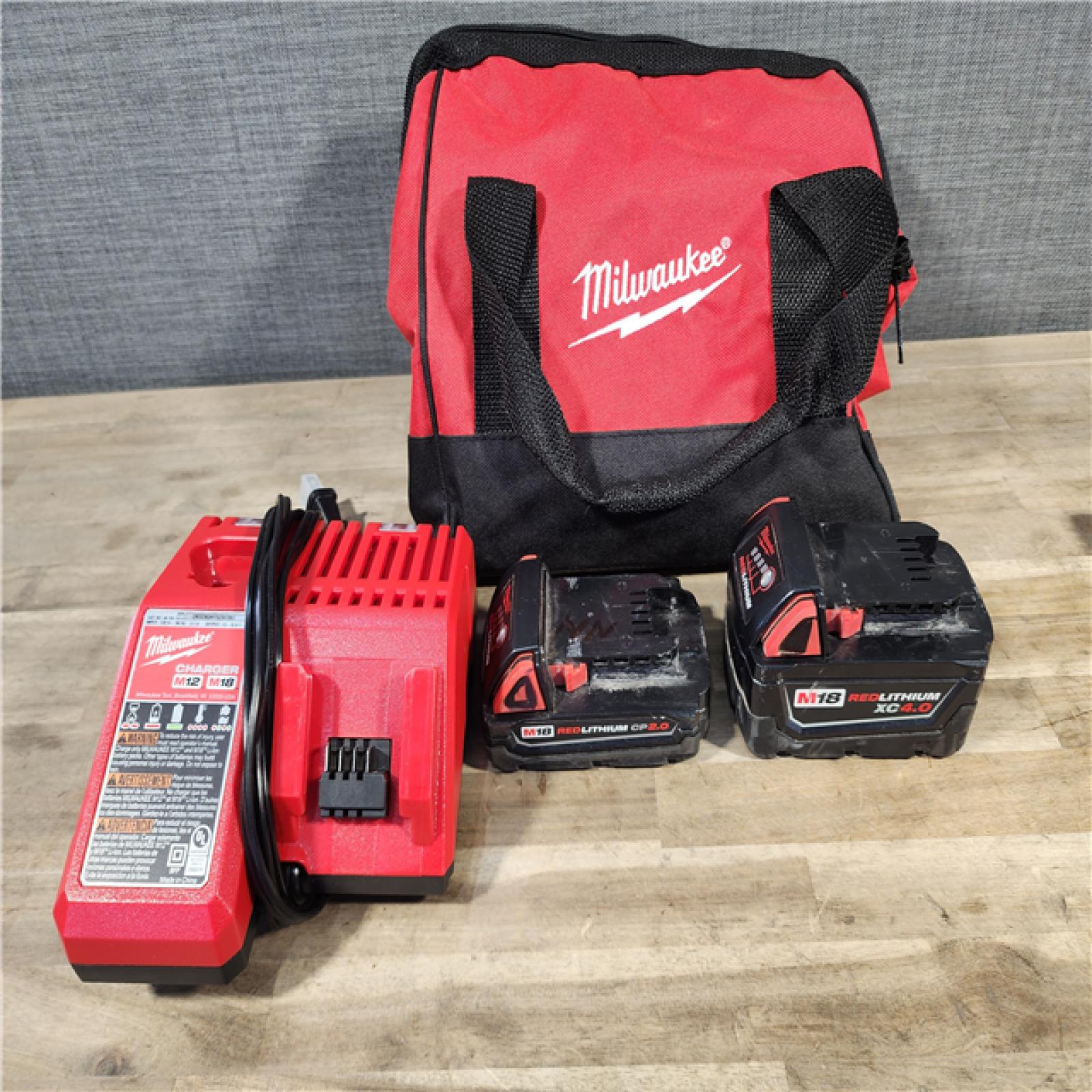 HOUSTON LOCATION - AS-IS M18 18-Volt Lithium-Ion Brushless Cordless Compact Hammer Drill/Impact Combo Kit (2-Tool) with (2) Batteries, Bag
