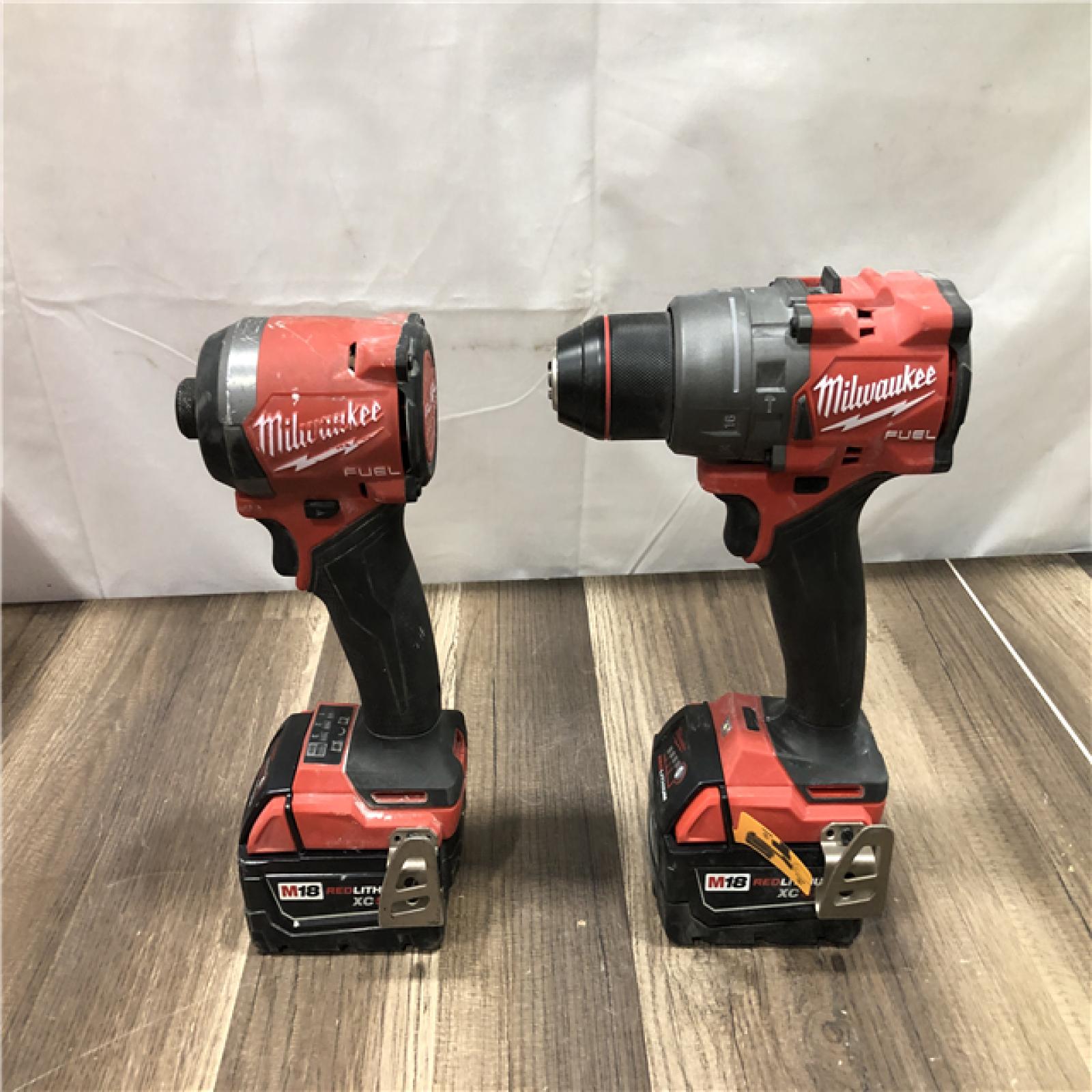 AS-IS Milwaukee FUEL 18V Lithium-Ion Brushless Cordless Hammer Drill and Impact Driver Combo Kit