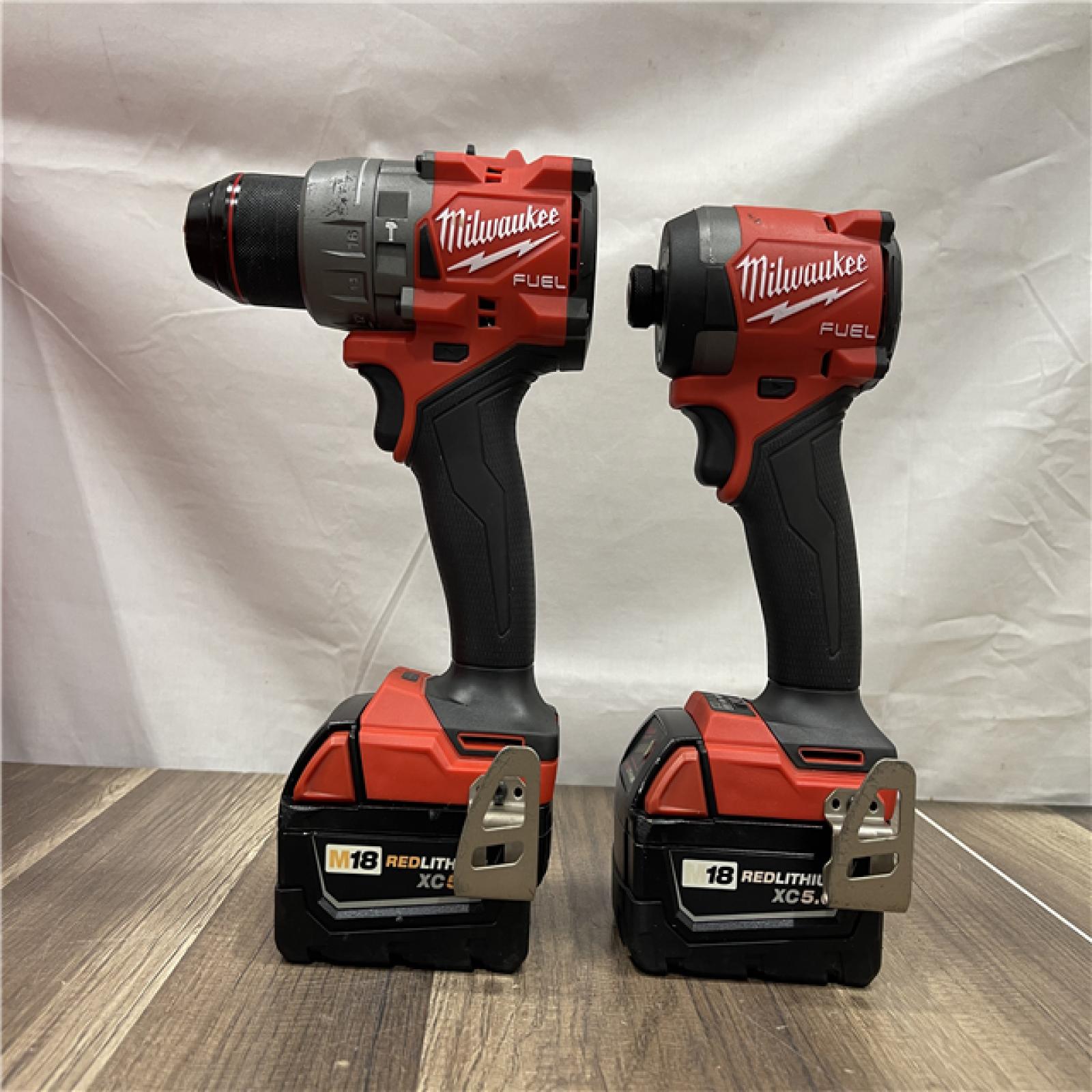 AS-IS Milwaukee FUEL 18V Lithium-Ion Brushless Cordless Hammer Drill and Impact Driver Combo Kit