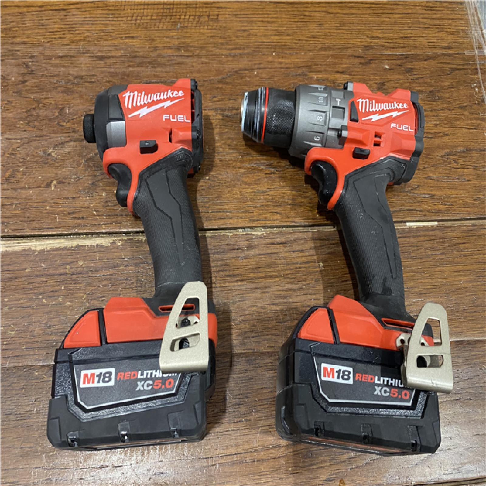 AS-IS MILWAUKEE M18 FUEL 18V Lithium-Ion Brushless Cordless Hammer Drill and Impact Driver Combo Kit (2-Tool) with 2 Batteries