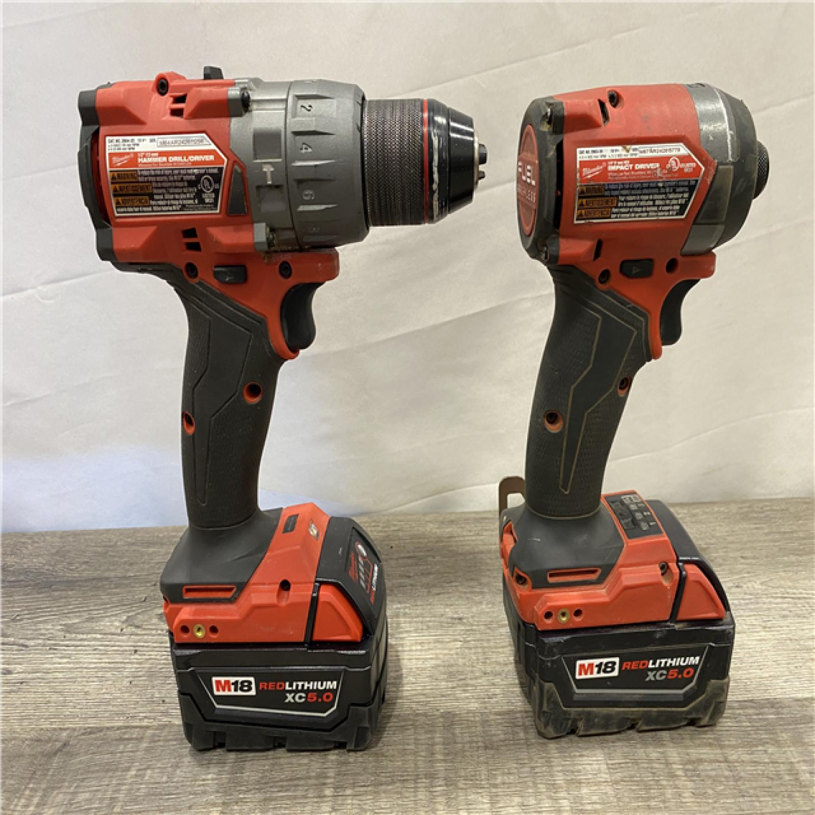 AS-IS Milwaukee FUEL 18V Lithium-Ion Brushless Cordless Hammer Drill and Impact Driver Combo Kit