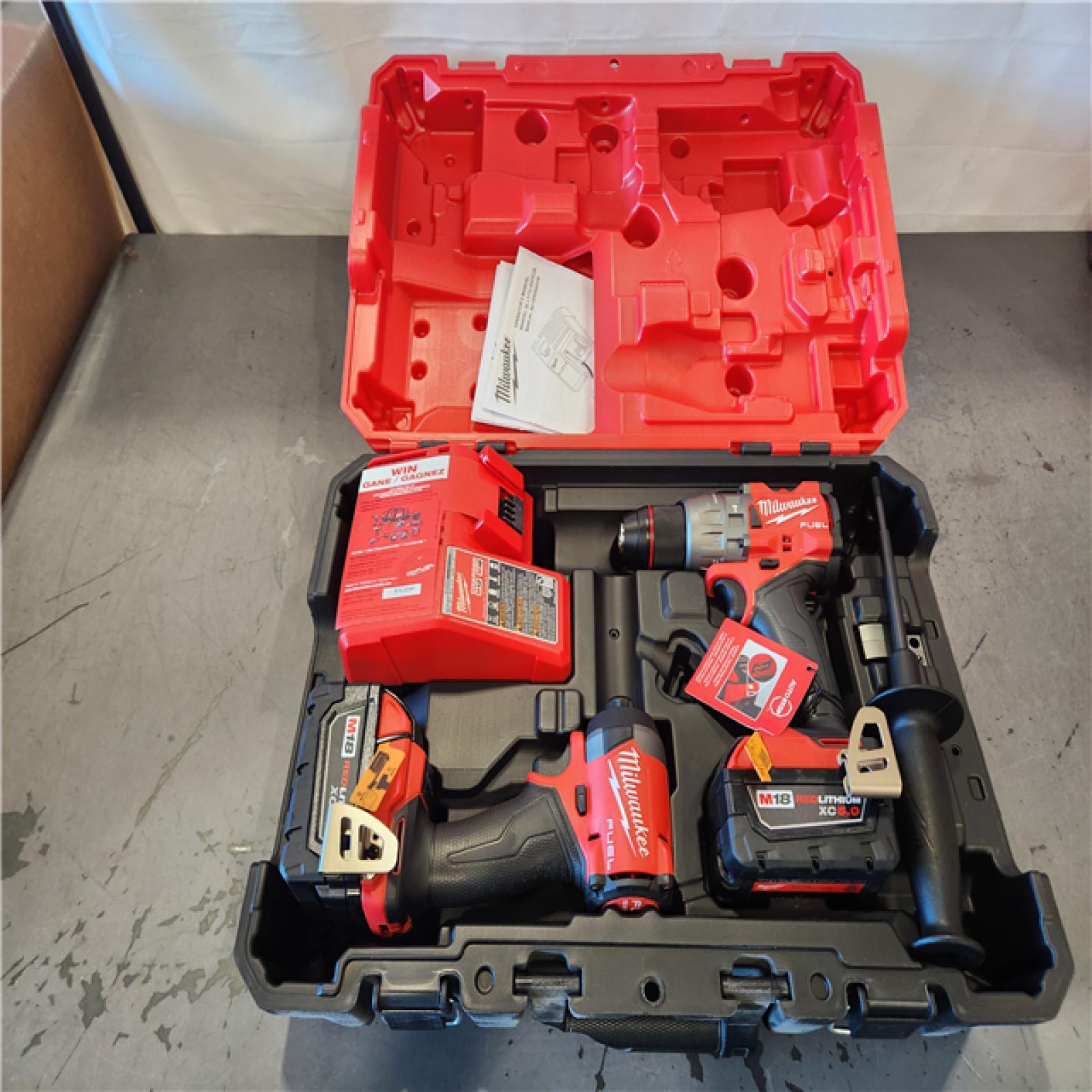 AS-IS- Milwaukee FUEL 18V Lithium-Ion Brushless Cordless Hammer Drill and Impact Driver Combo Kit