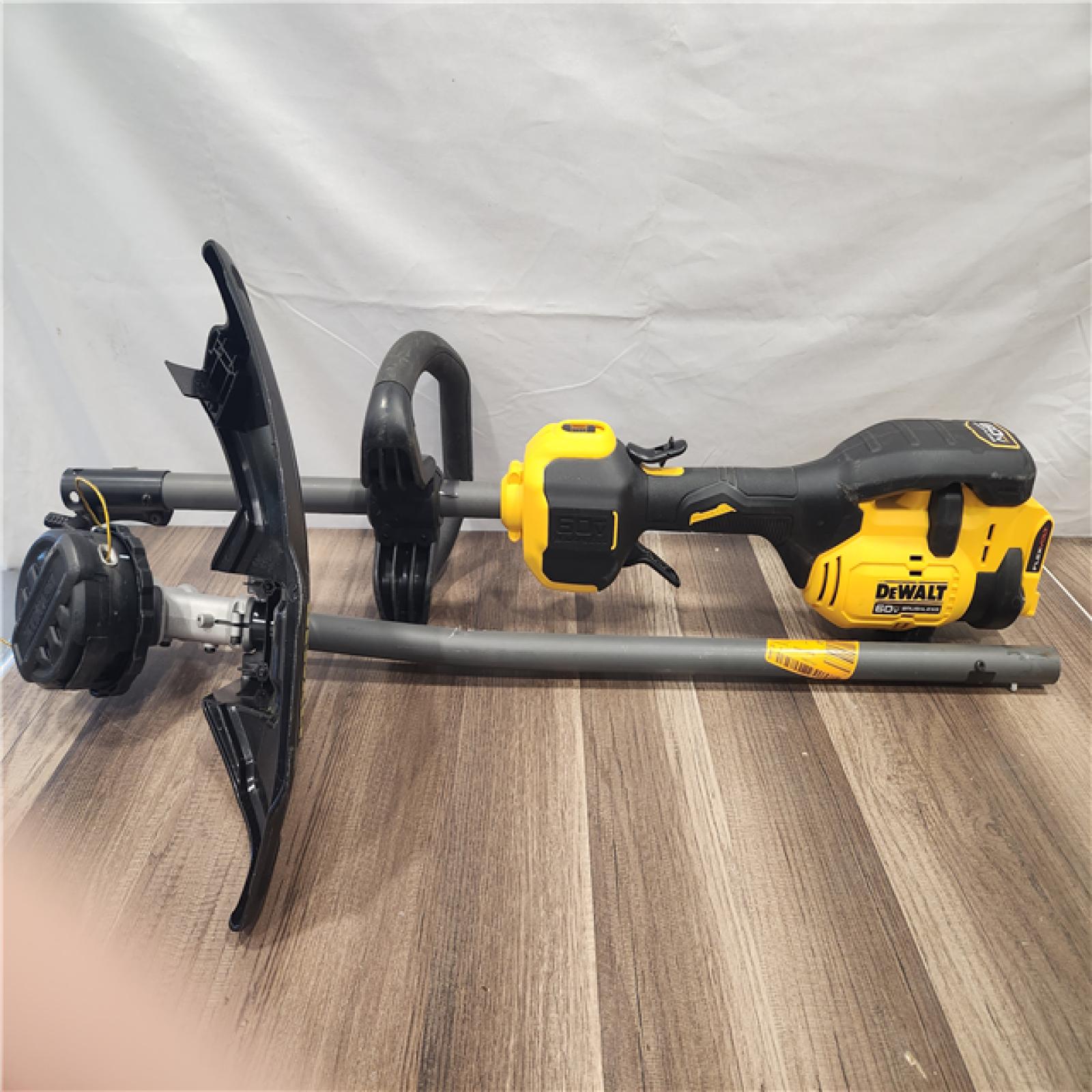 AS-IS- FLEXVOLT 60V MAX 17 in -trimmer with cordless attachment powered by a battery