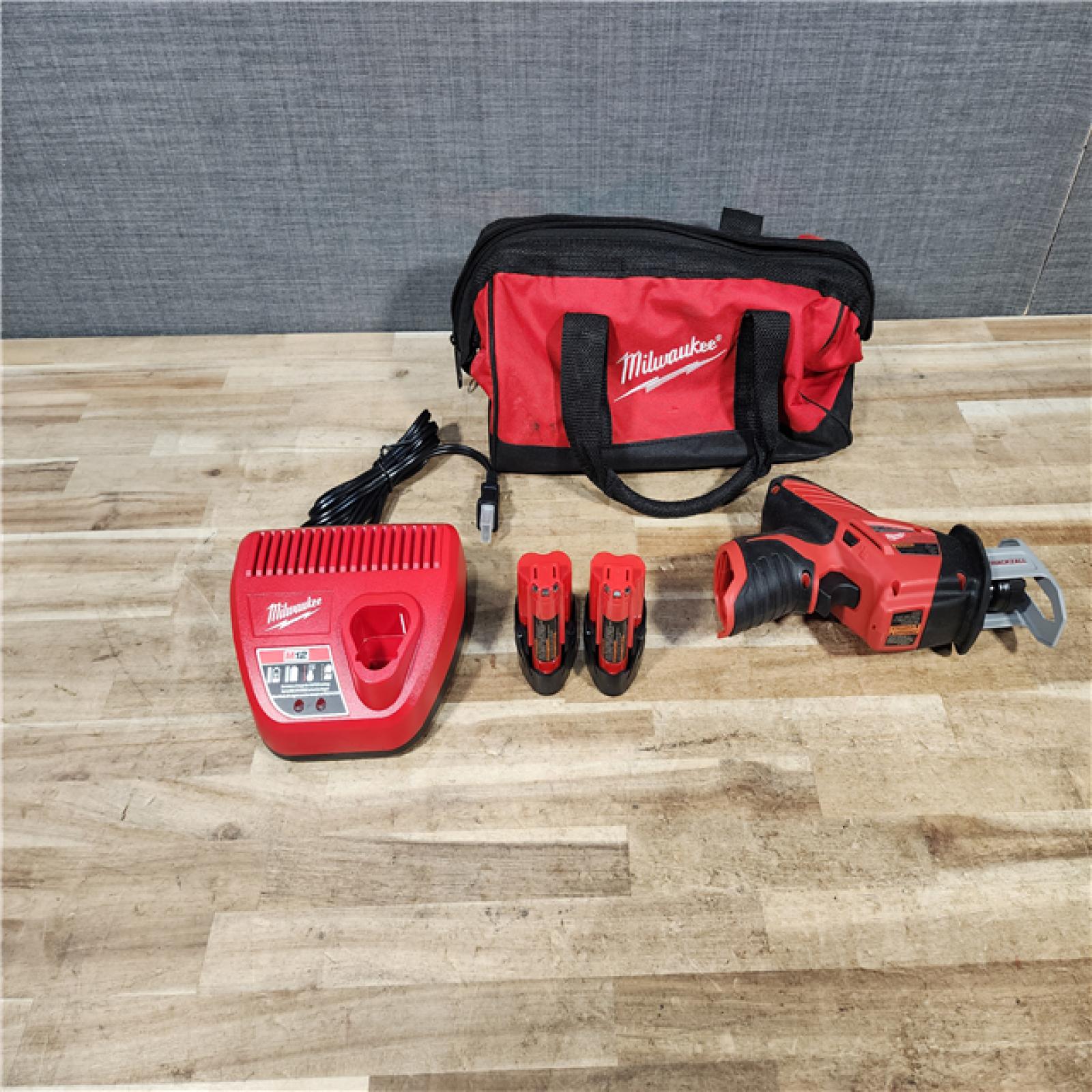 HOUSTON LOCATION - AS - IS Milwaukee M12 12-Volt Lithium-Ion HACKZALL Cordless Reciprocating Saw W/ (2) 1.5Ah Batteries  Charger and Bag