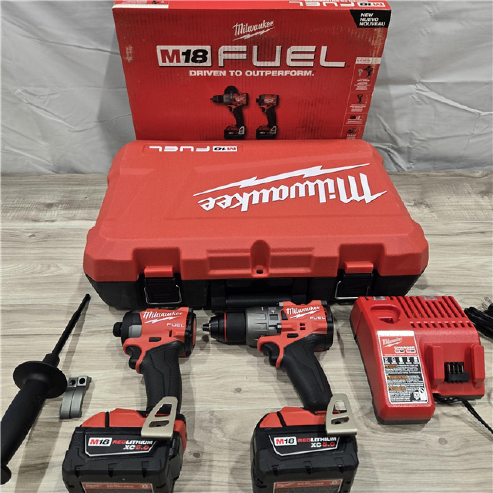AS-IS MILWAUKEE FUEL 18V Lithium-Ion Brushless Cordless Hammer Drill and Impact Driver Combo Kit (2-Tool) with 2 Batteries