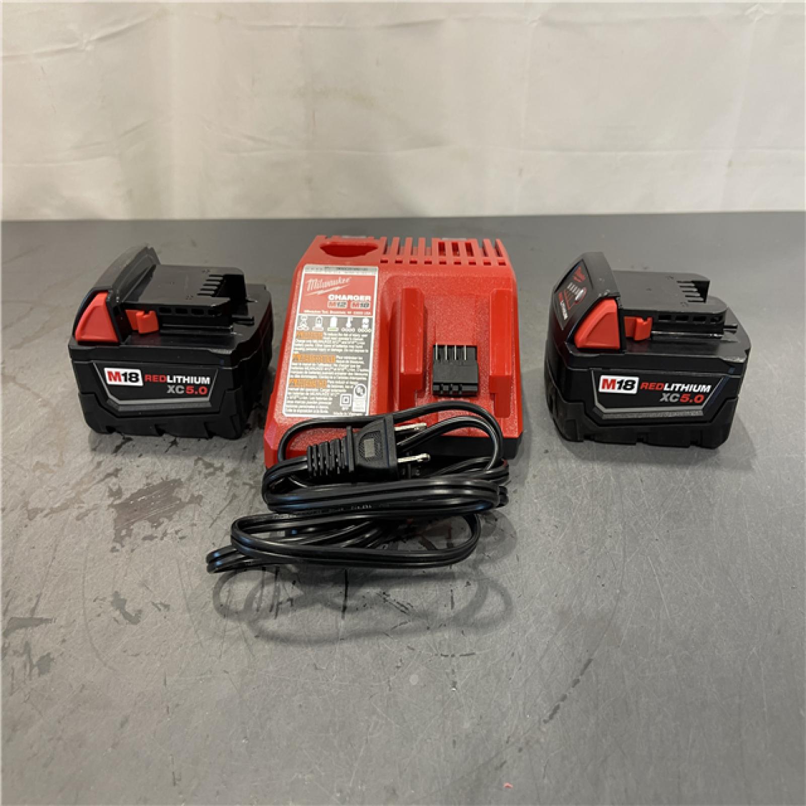 AS-IS - Milwaukee M18 18-Volt Lithium-Ion XC Starter Kit with Two 5.0Ah Batteries and Charger