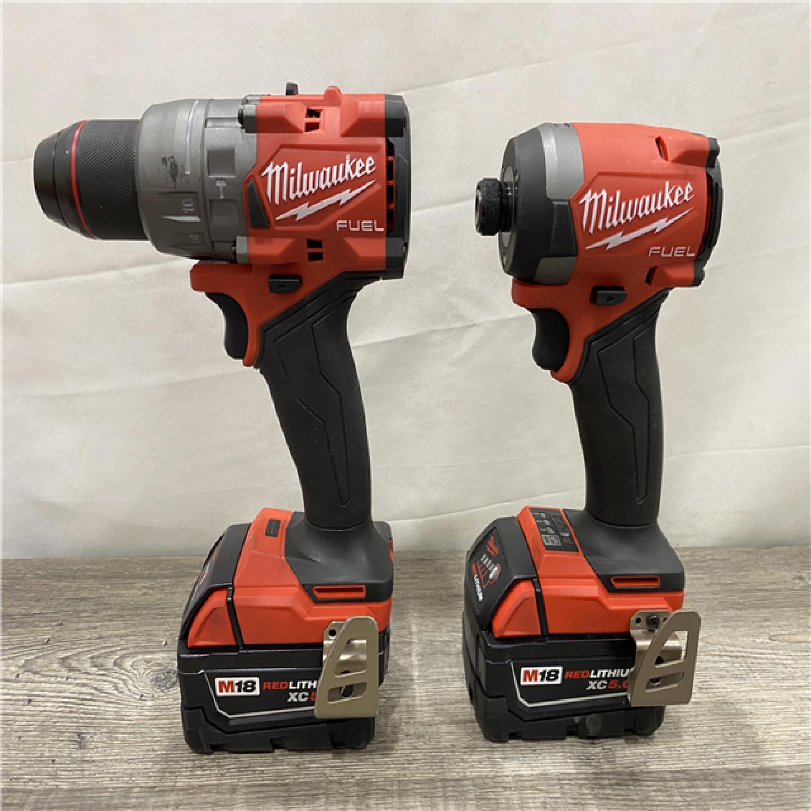 AS-IS Milwaukee FUEL 18V Lithium-Ion Brushless Cordless Hammer Drill and Impact Driver Combo Kit